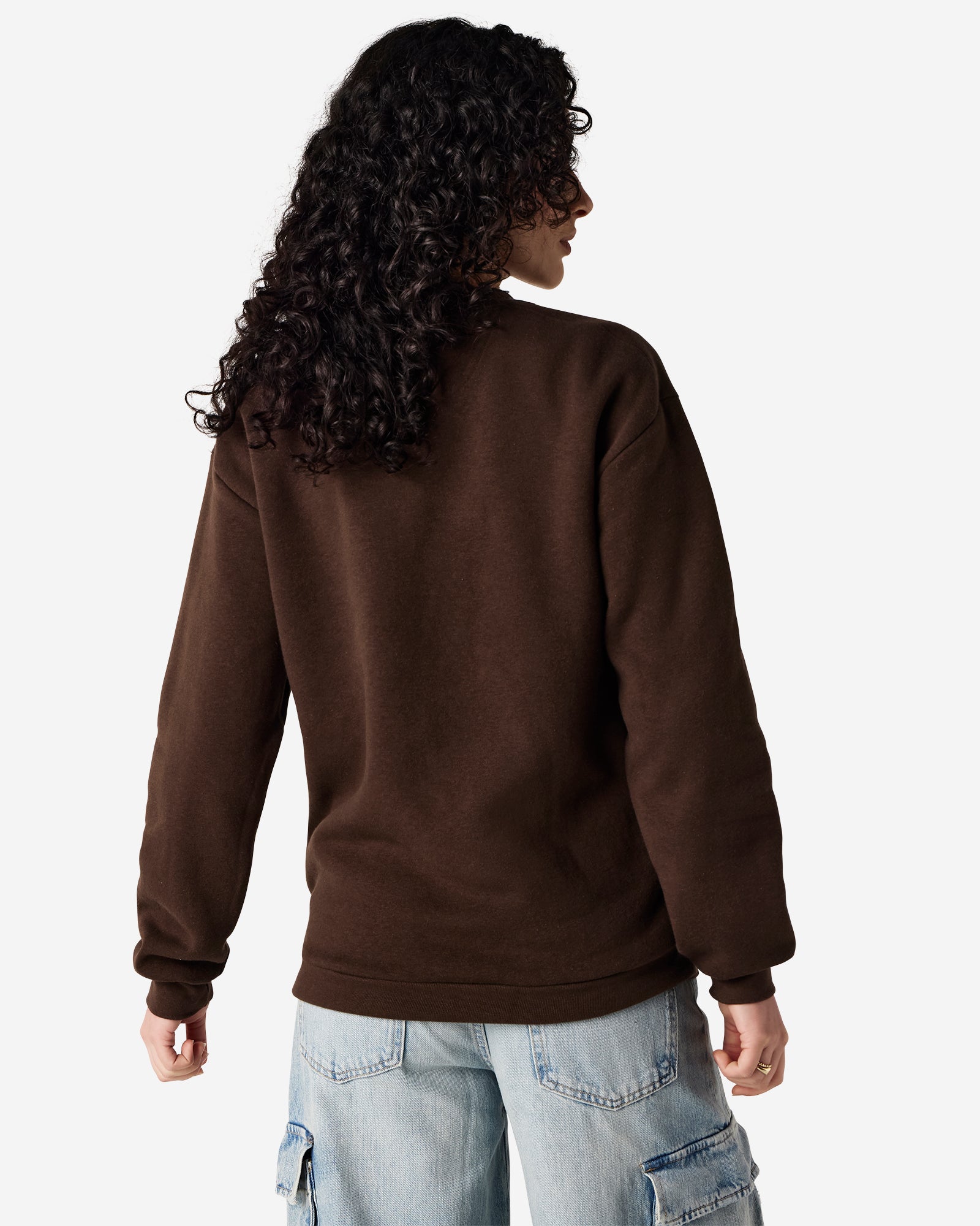 Female model wearing a Reflex Unisex Crewneck Sweatshirt (back pose) -brown