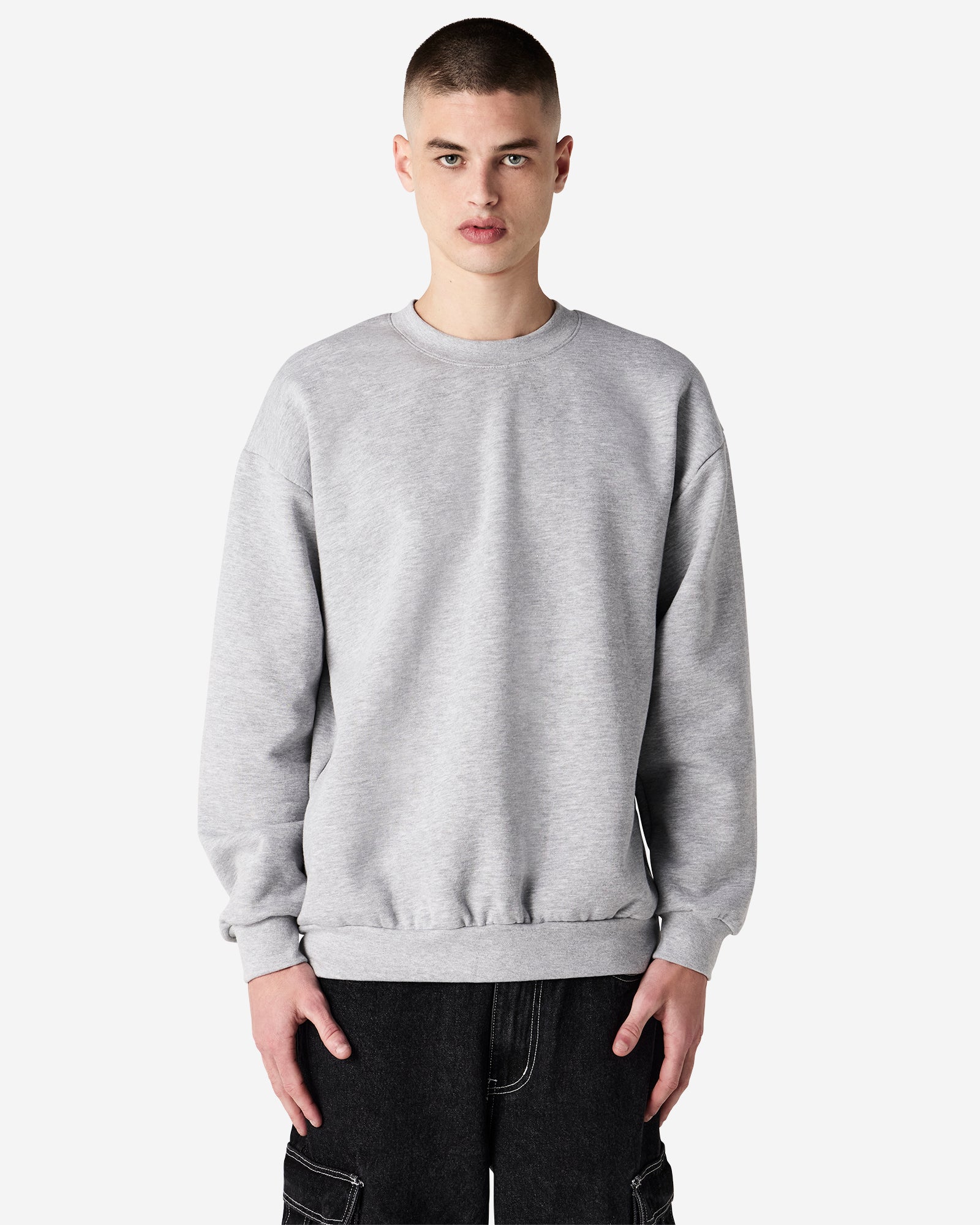 Male model wearing a Reflex Unisex Crewneck Sweatshirt (front pose) -heather grey