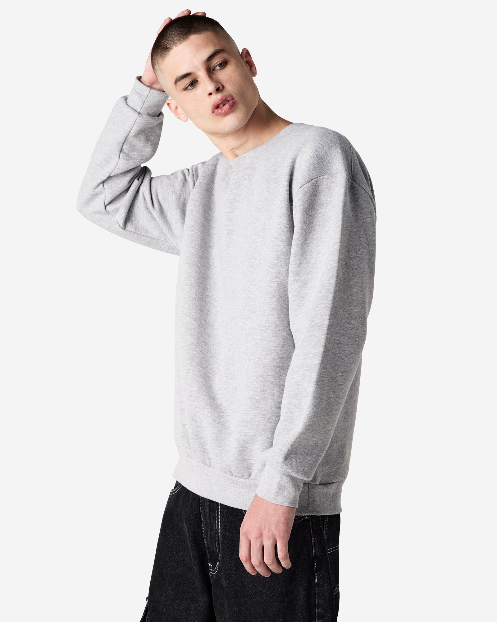 Male model wearing a Reflex Unisex Crewneck Sweatshirt (front pose) -heather grey
