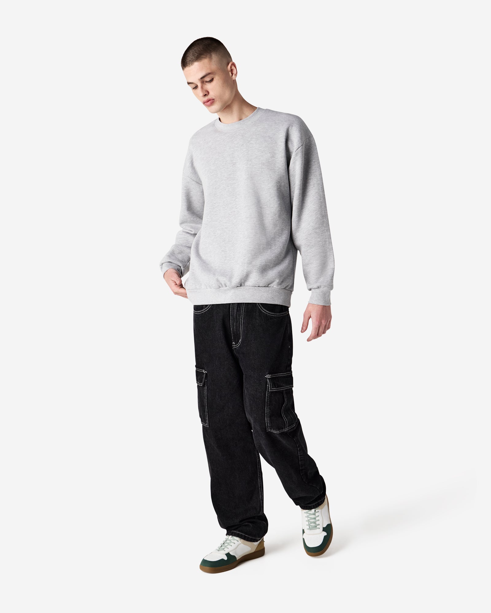 Male model wearing a Reflex Unisex Crewneck Sweatshirt (front pose) -heather grey