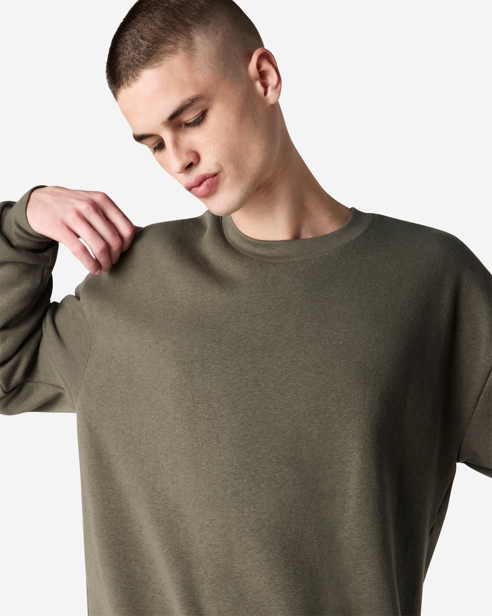 Male model wearing a Reflex Unisex Crewneck Sweatshirt (front pose) -lieutenant