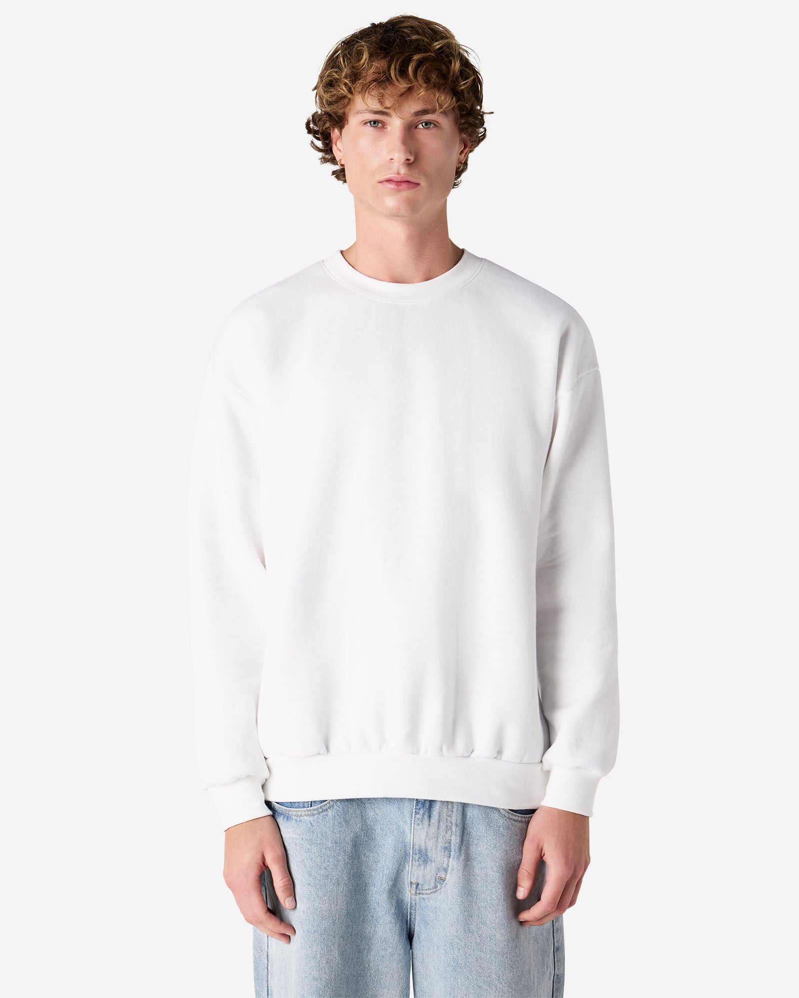 Male model wearing a Reflex Unisex Crewneck Sweatshirt (front pose) -white
