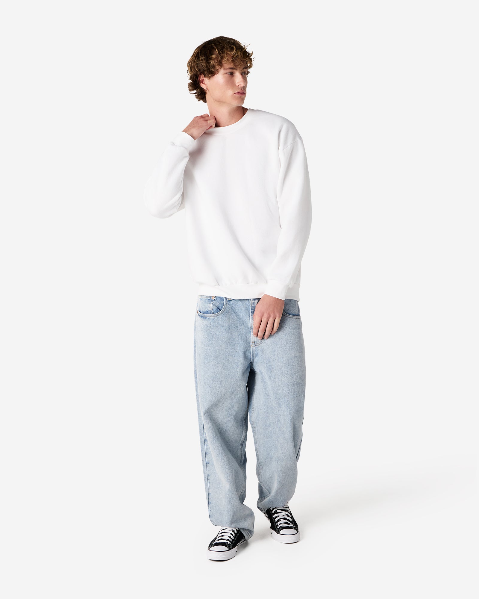 Male model wearing a Reflex Unisex Crewneck Sweatshirt (front pose) -white