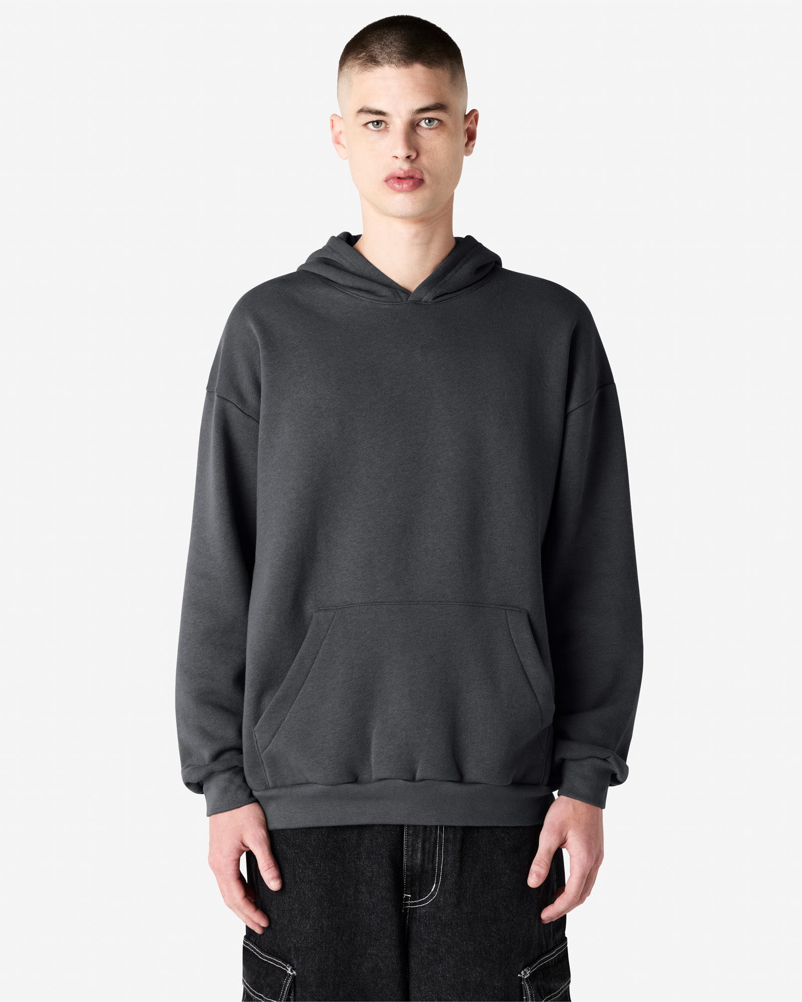Male model wearing a Reflex Unisex Hooded Sweatshirt (front pose) -asphalt