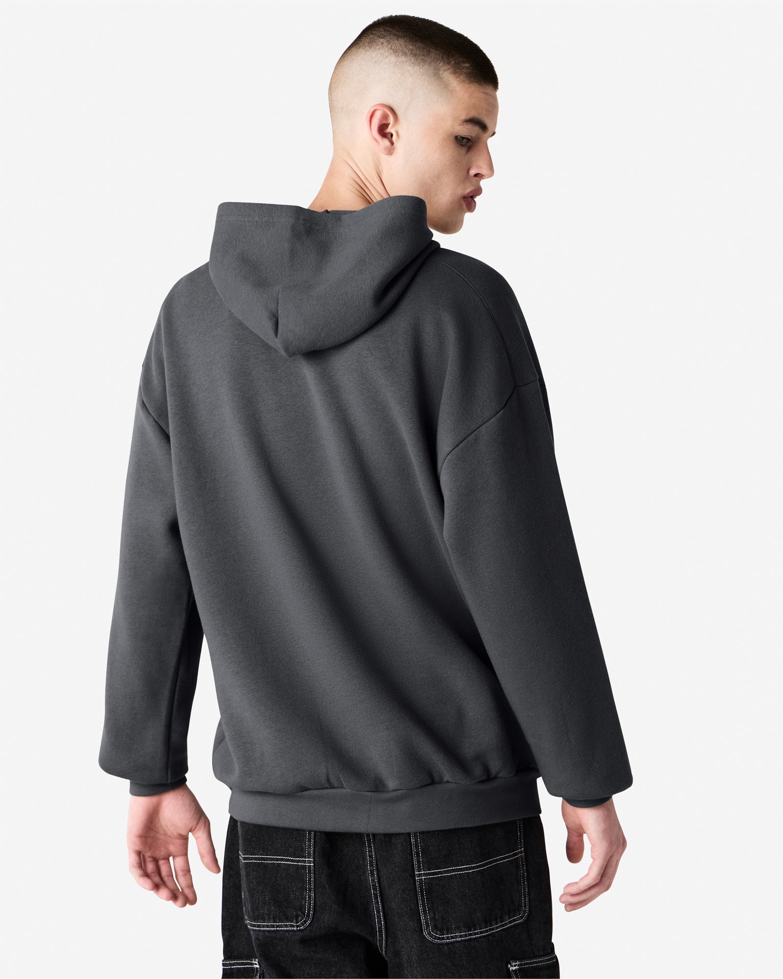 Male model wearing a Reflex Unisex Hooded Sweatshirt (back pose) -asphalt