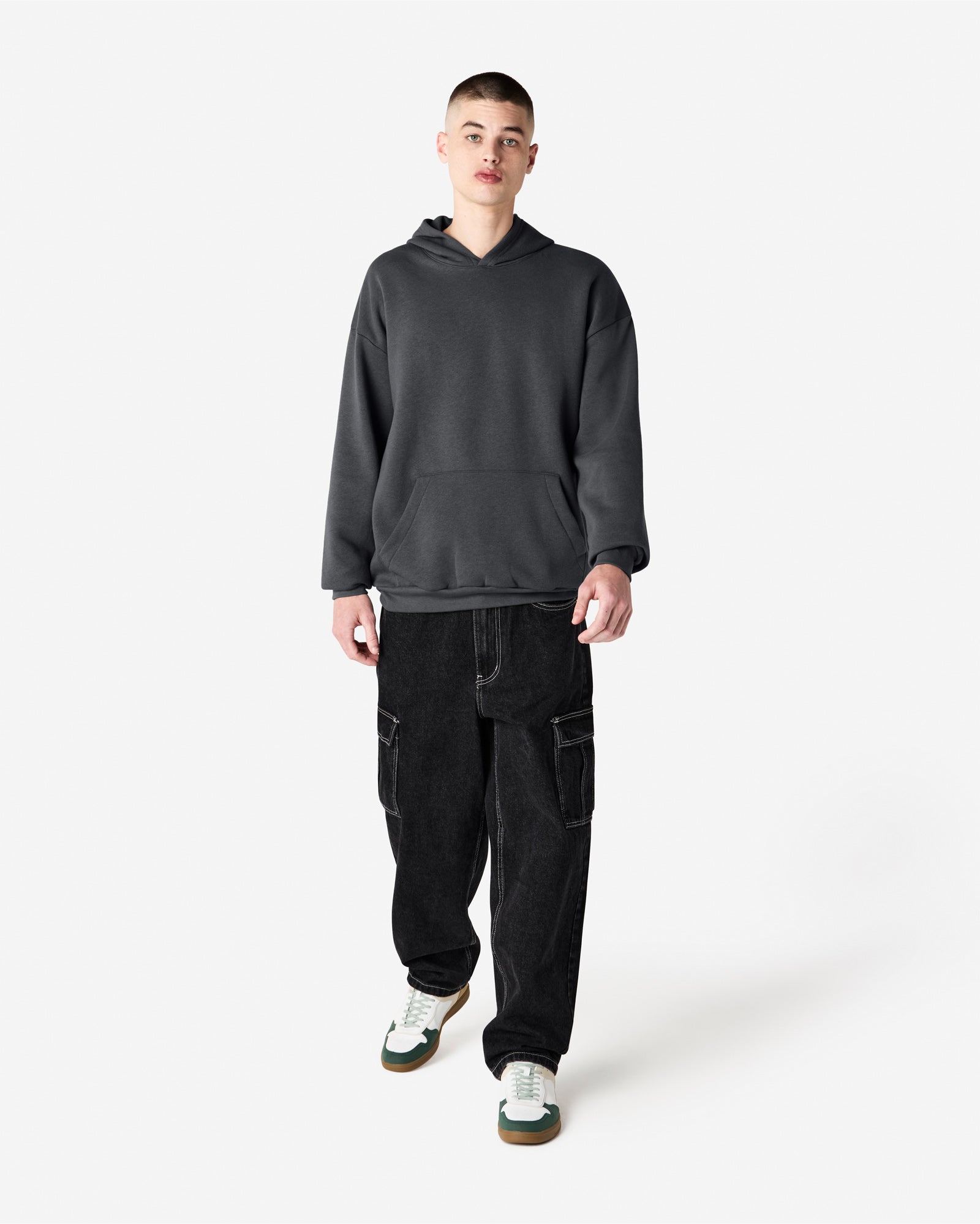 Male model wearing a Reflex Unisex Hooded Sweatshirt (front pose) -asphalt