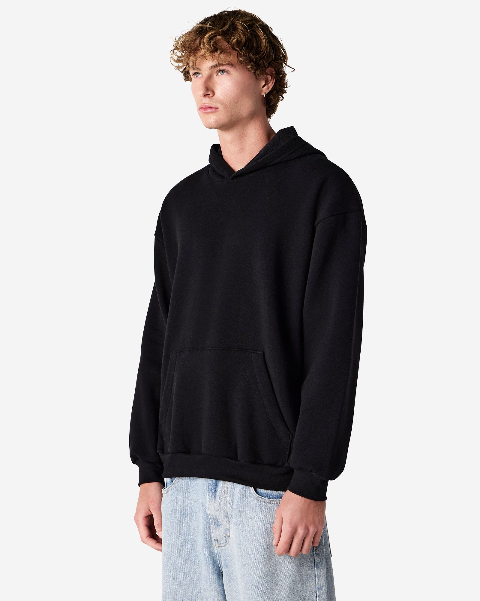 Male model wearing a Reflex Unisex Hooded Sweatshirt (front pose) -black
