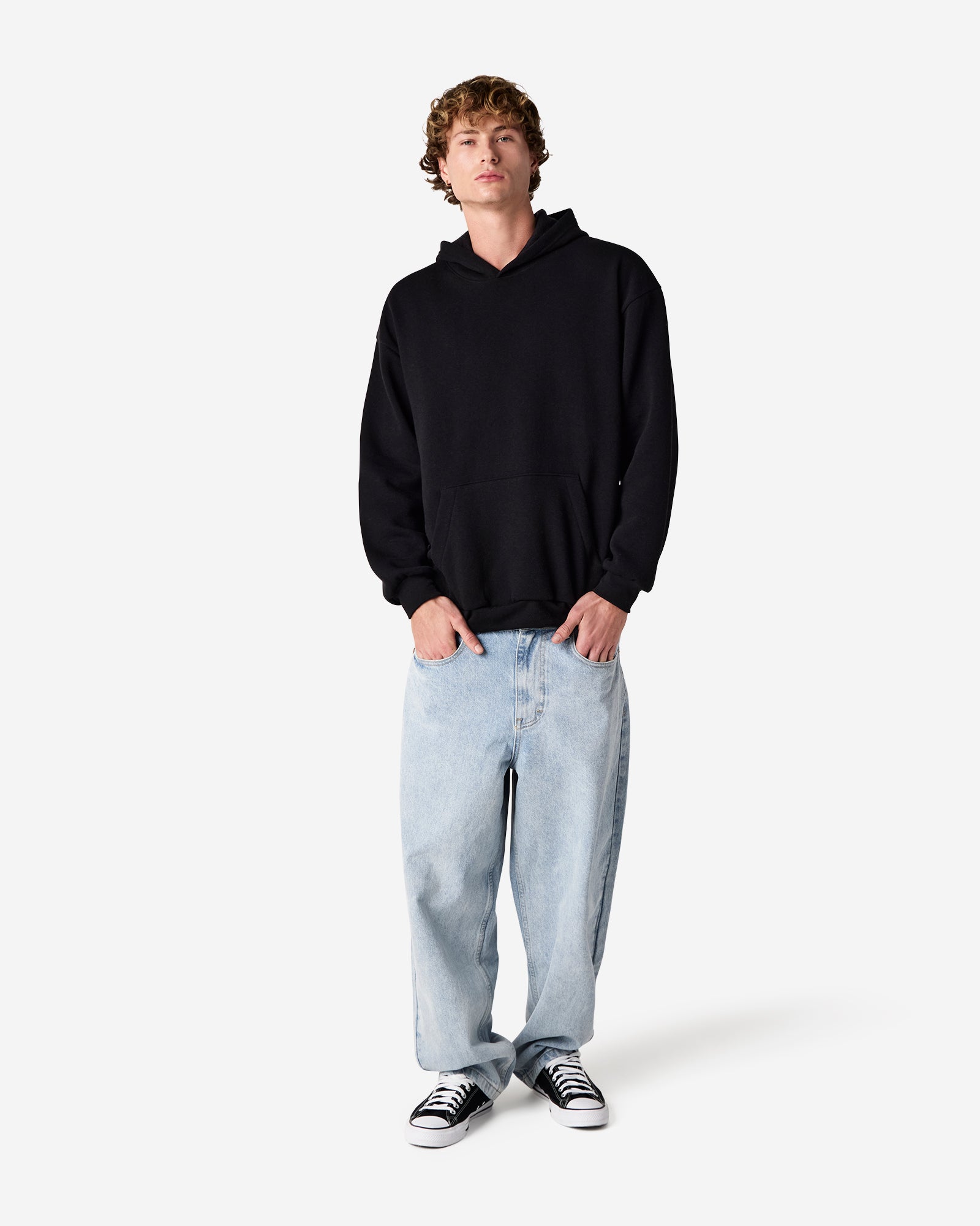 Male model wearing a Reflex Unisex Hooded Sweatshirt (front pose) -black