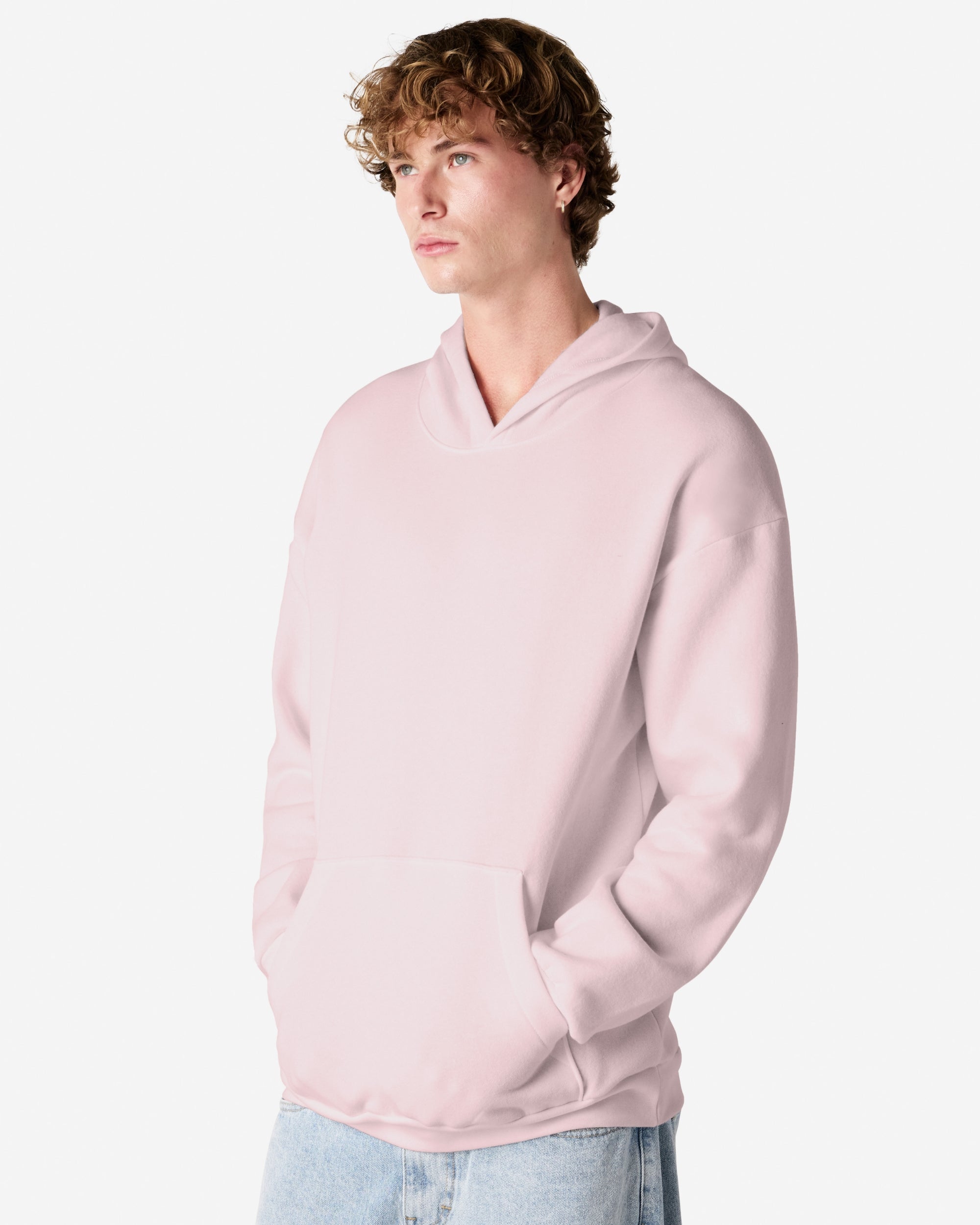 Male model wearing a Reflex Unisex Hooded Sweatshirt (front pose) -blush