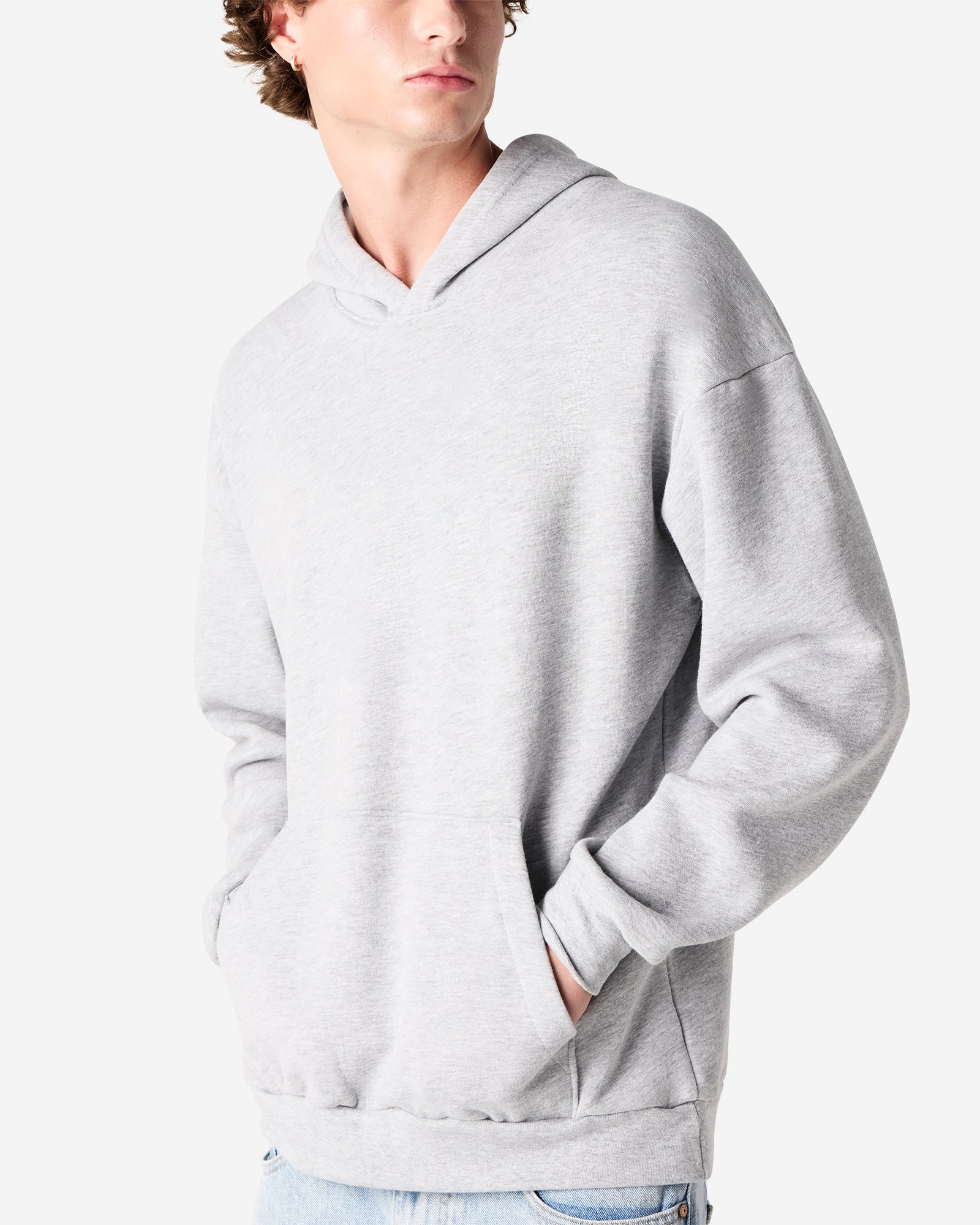 Male model wearing a Reflex Unisex Hooded Sweatshirt (front pose) -heather grey