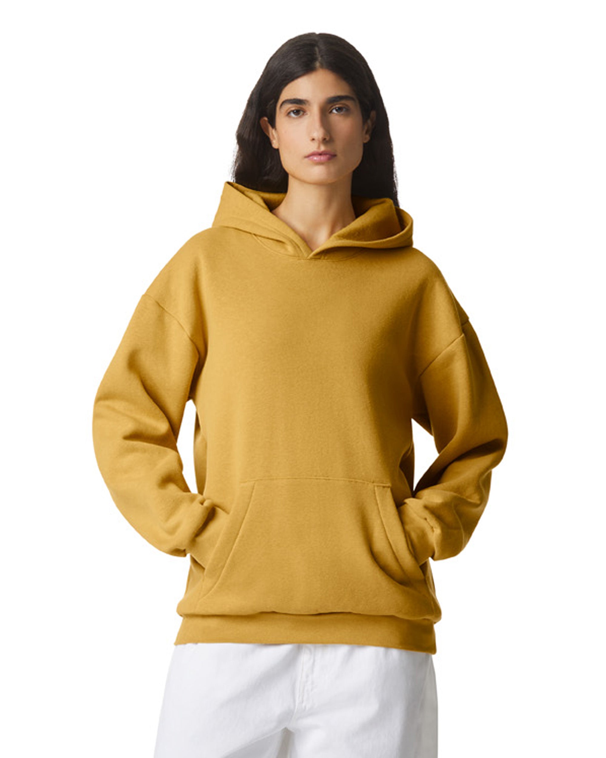 Female model wearing a Reflex Unisex Hooded Sweatshirt (front pose) -mustard