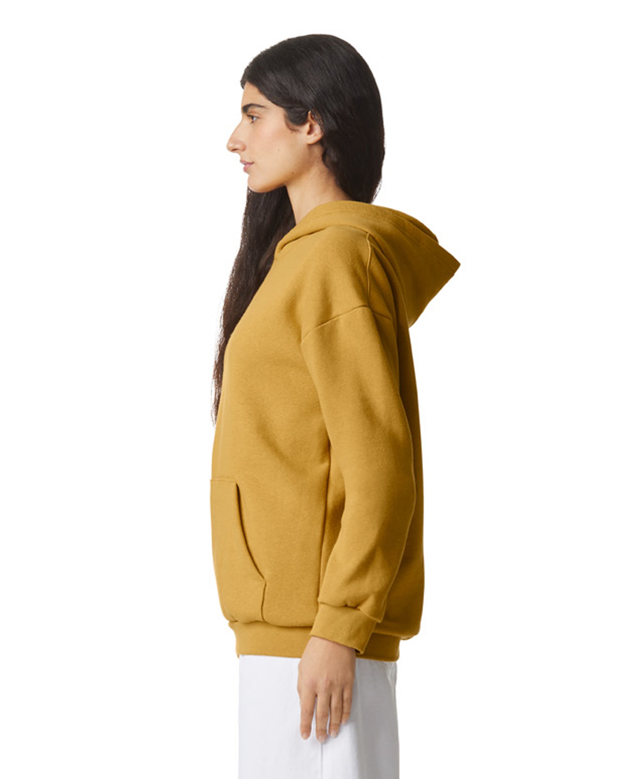 Female model wearing a Reflex Unisex Hooded Sweatshirt (side pose) -mustard