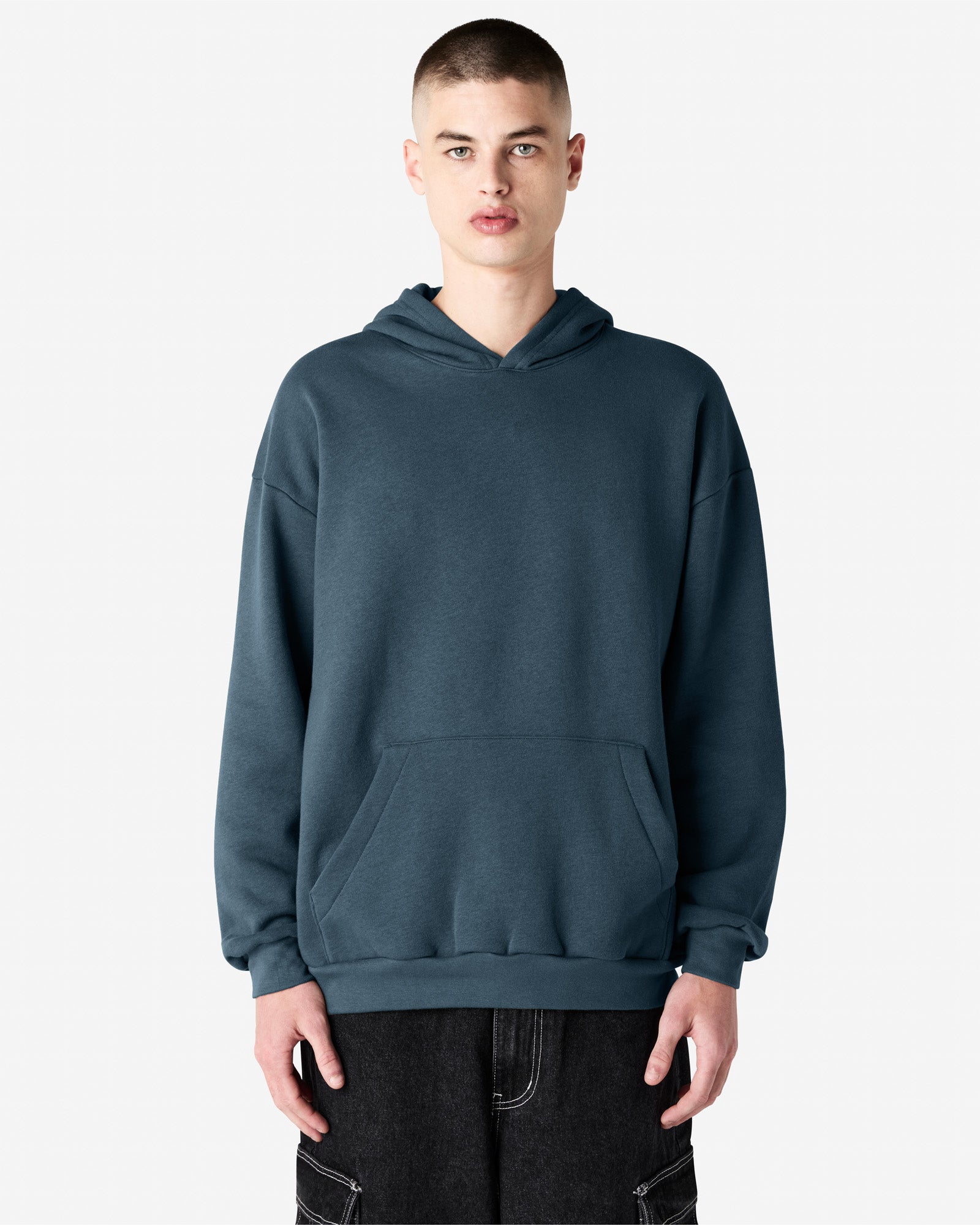 Male model wearing a Reflex Unisex Hooded Sweatshirt (front pose) -sea blue