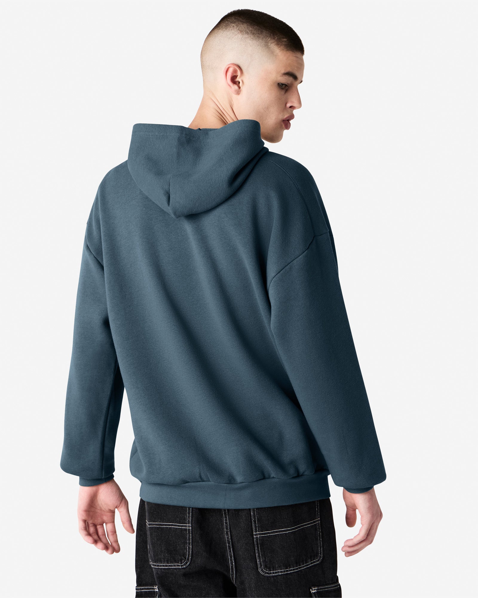 Male model wearing a Reflex Unisex Hooded Sweatshirt (back pose) -sea blue