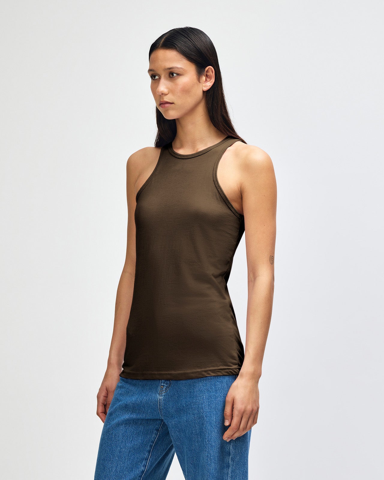 Female model wearing black colour American Apparel Fine Jersey Unisex Tank Top (front pose) -heather army