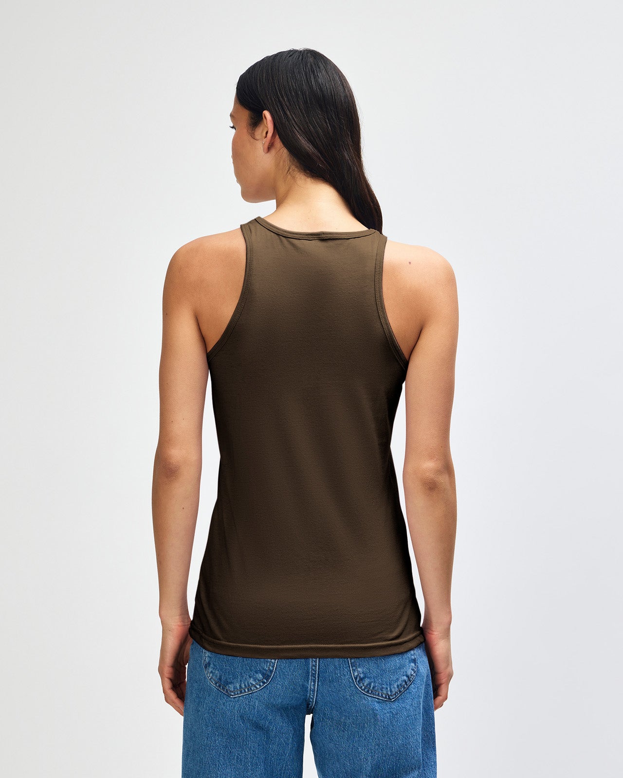 Female model wearing black colour American Apparel Fine Jersey Unisex Tank Top (front pose) -heather army