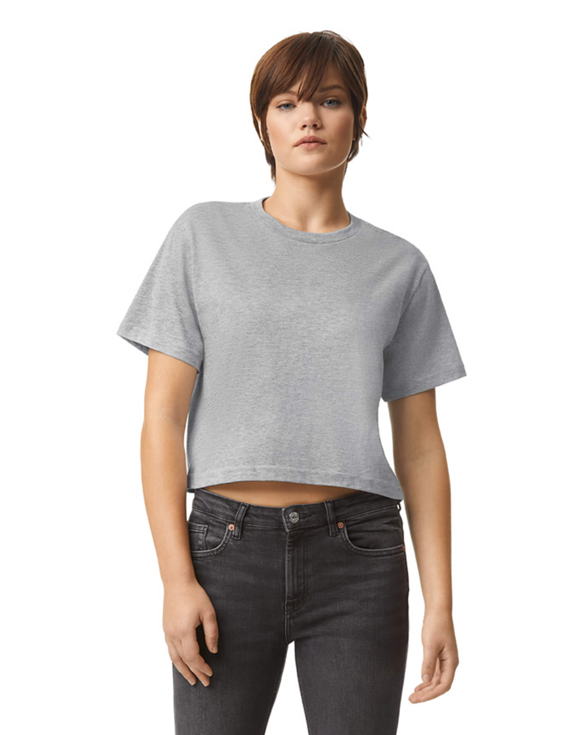 Female model wearing an American Apparel Fine Jersey Women's Boxy Tee in Heather Sport Grey, paired with black jeans, standing against a plain background (front pose) -heather grey