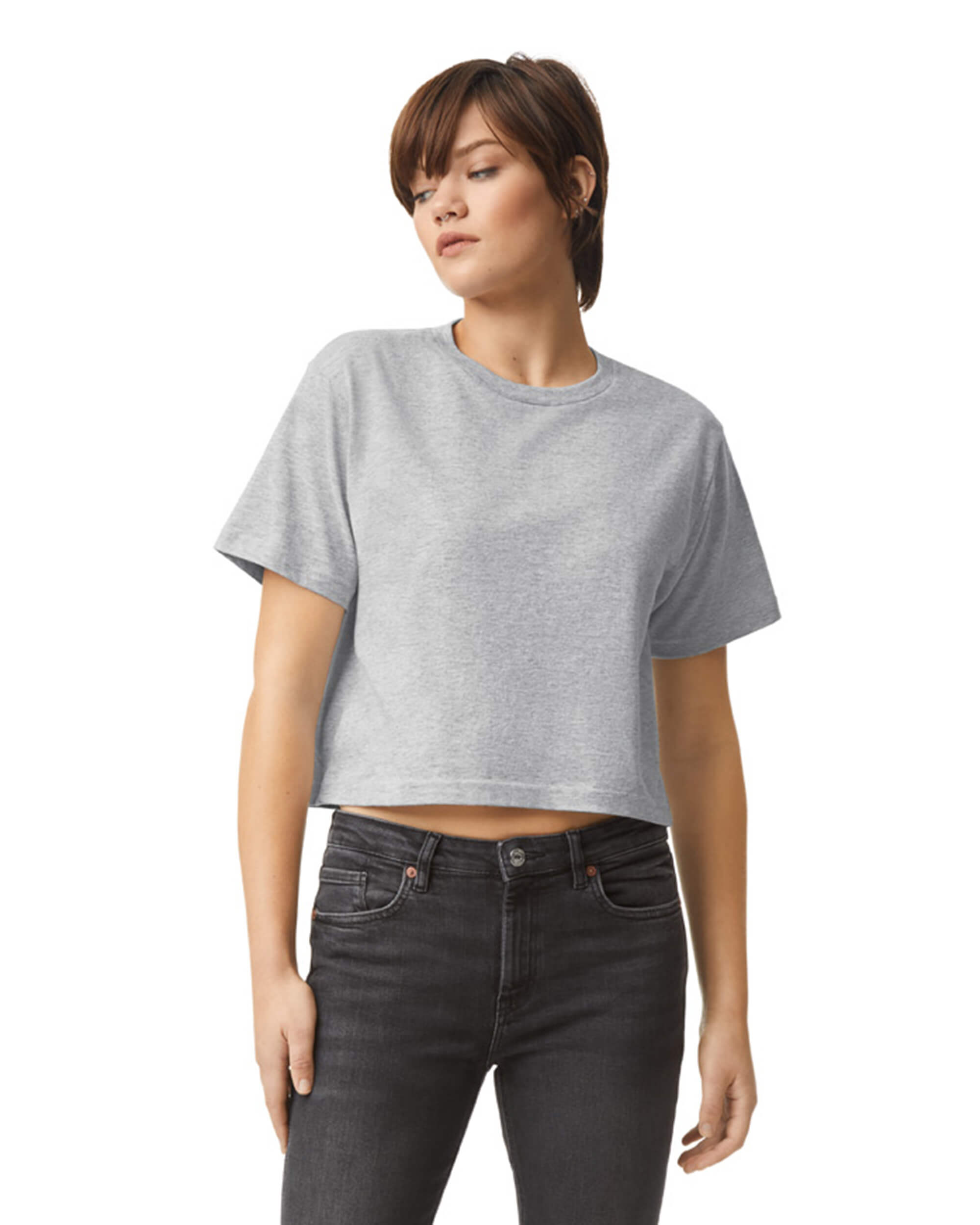 Female model wearing an American Apparel Fine Jersey Women's Boxy Tee in Heather Sport Grey, paired with black jeans, standing against a plain background (front pose) -heather grey