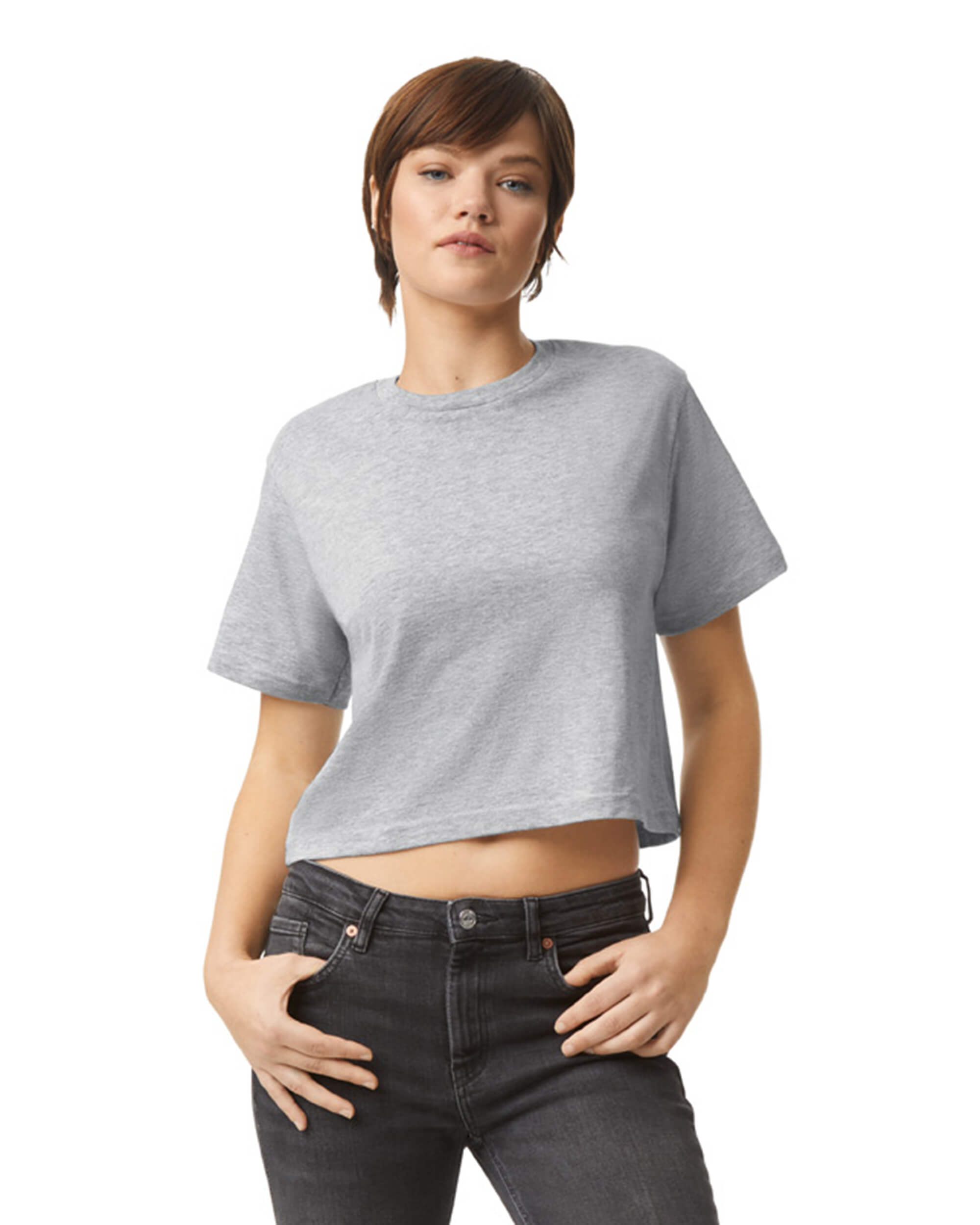 Female model wearing an American Apparel Fine Jersey Women's Boxy Tee in Heather Sport Grey, paired with black jeans, standing against a plain background (front pose) -heather grey