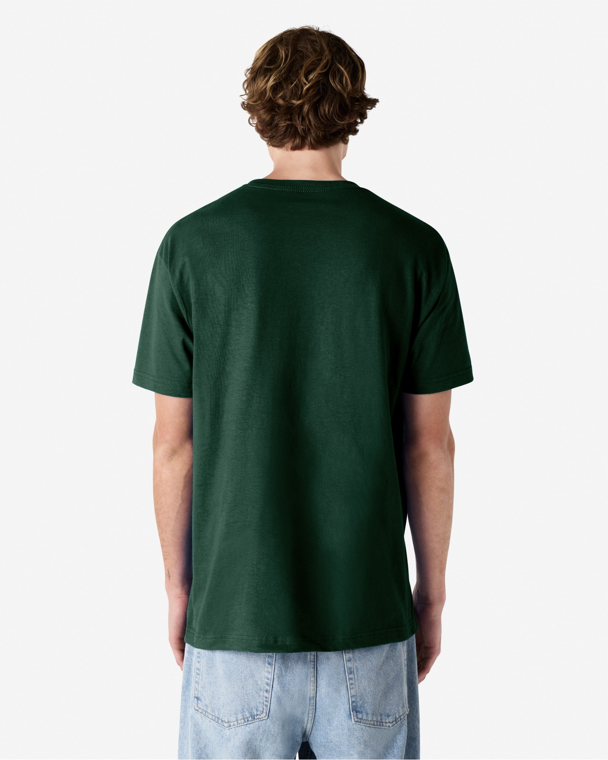 Male Model wearing a Forest Heavyweight Unisex Short Sleeve Crew Neck Tee, paired with blue jeans, standing against a plain background (back pose) -forest green