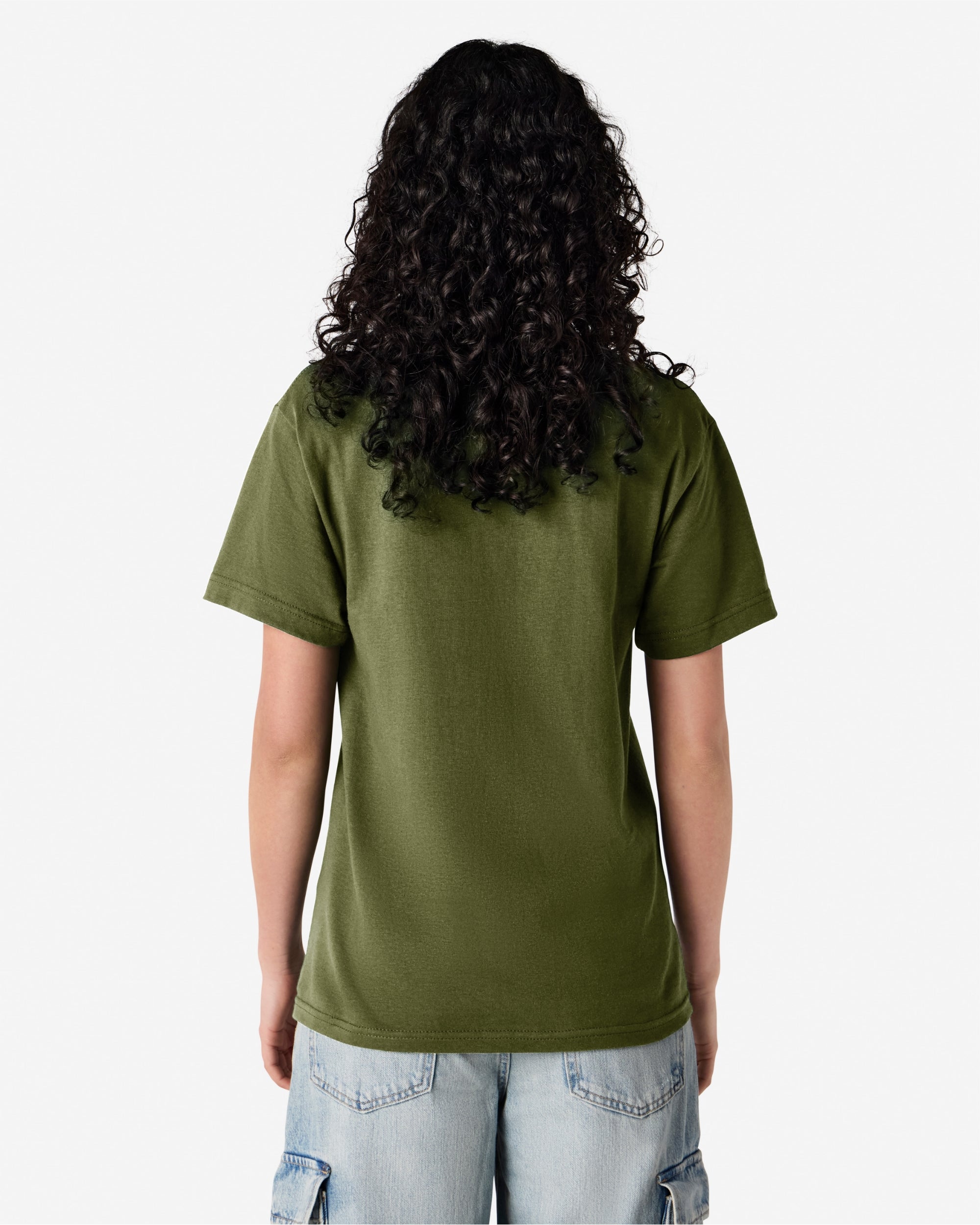 Female Model wearing a Military Green Heavyweight Unisex Short Sleeve Crew Neck Tee, paired with blue jeans, standing against a plain background (back pose) -military green