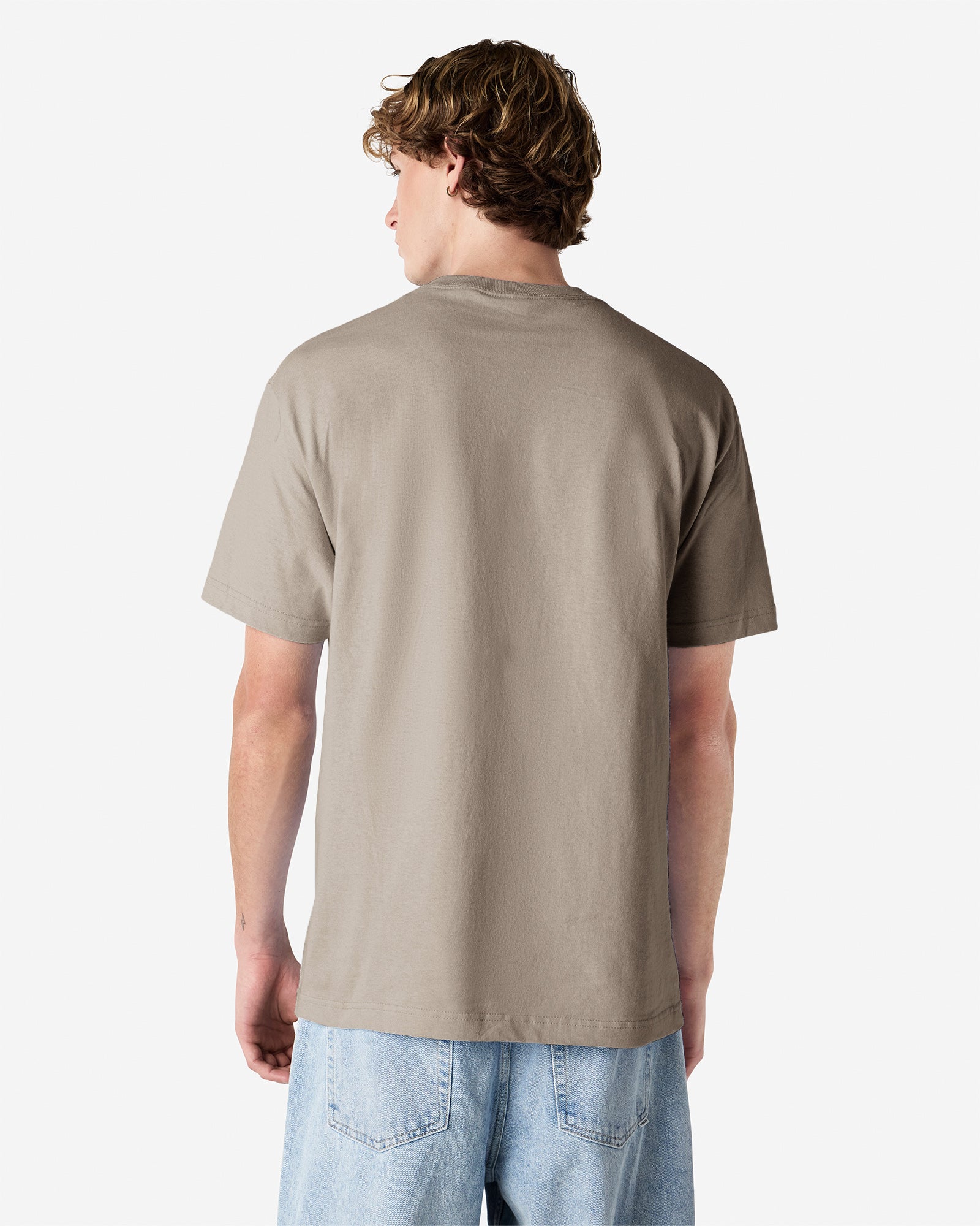 Male Model wearing a Slate Heavyweight Unisex Short Sleeve Crew Neck Tee, paired with blue jeans, standing against a plain background (back pose) -Slate