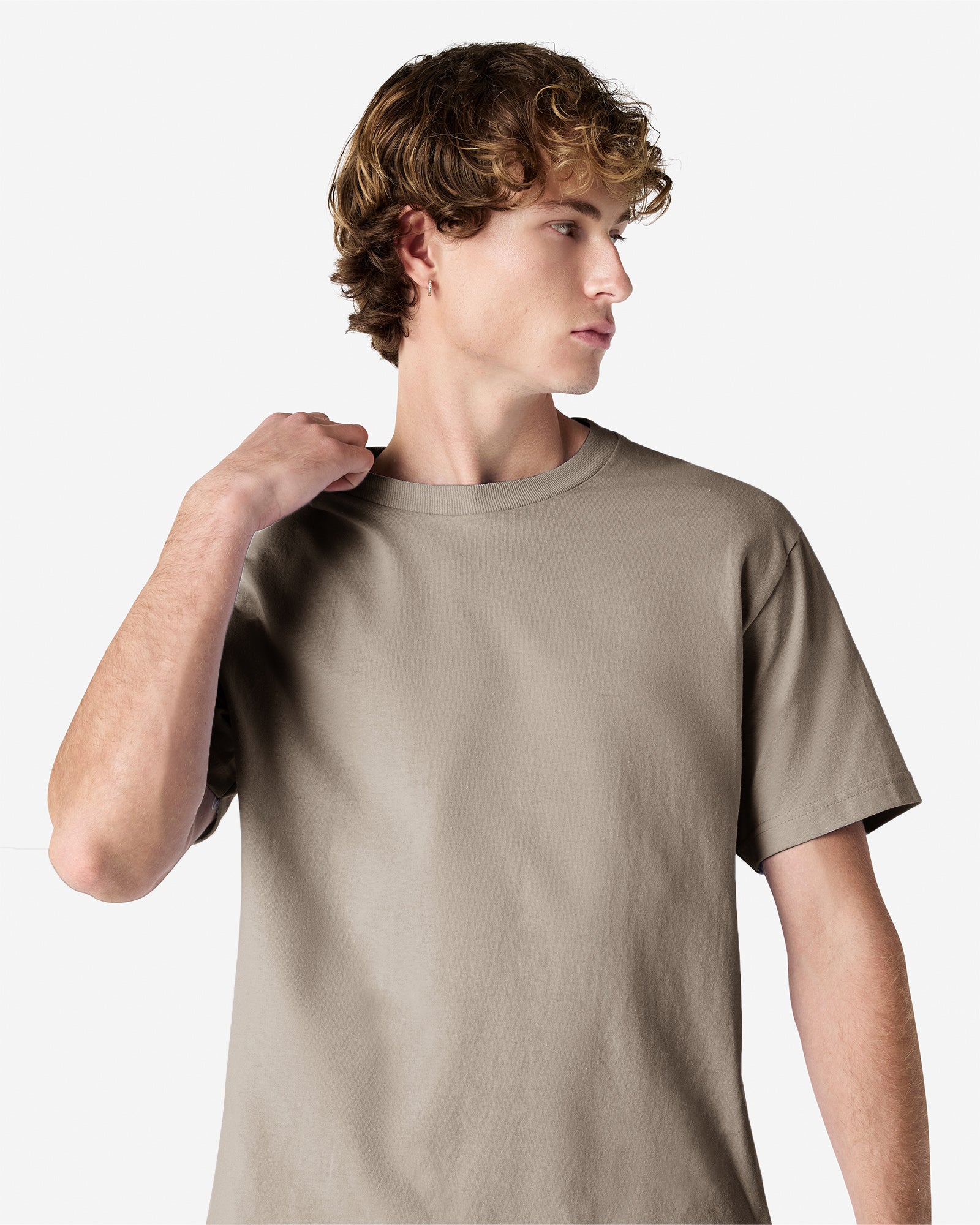 Male Model wearing a Slate Heavyweight Unisex Short Sleeve Crew Neck Tee, paired with blue jeans, standing against a plain background (front pose) -slate