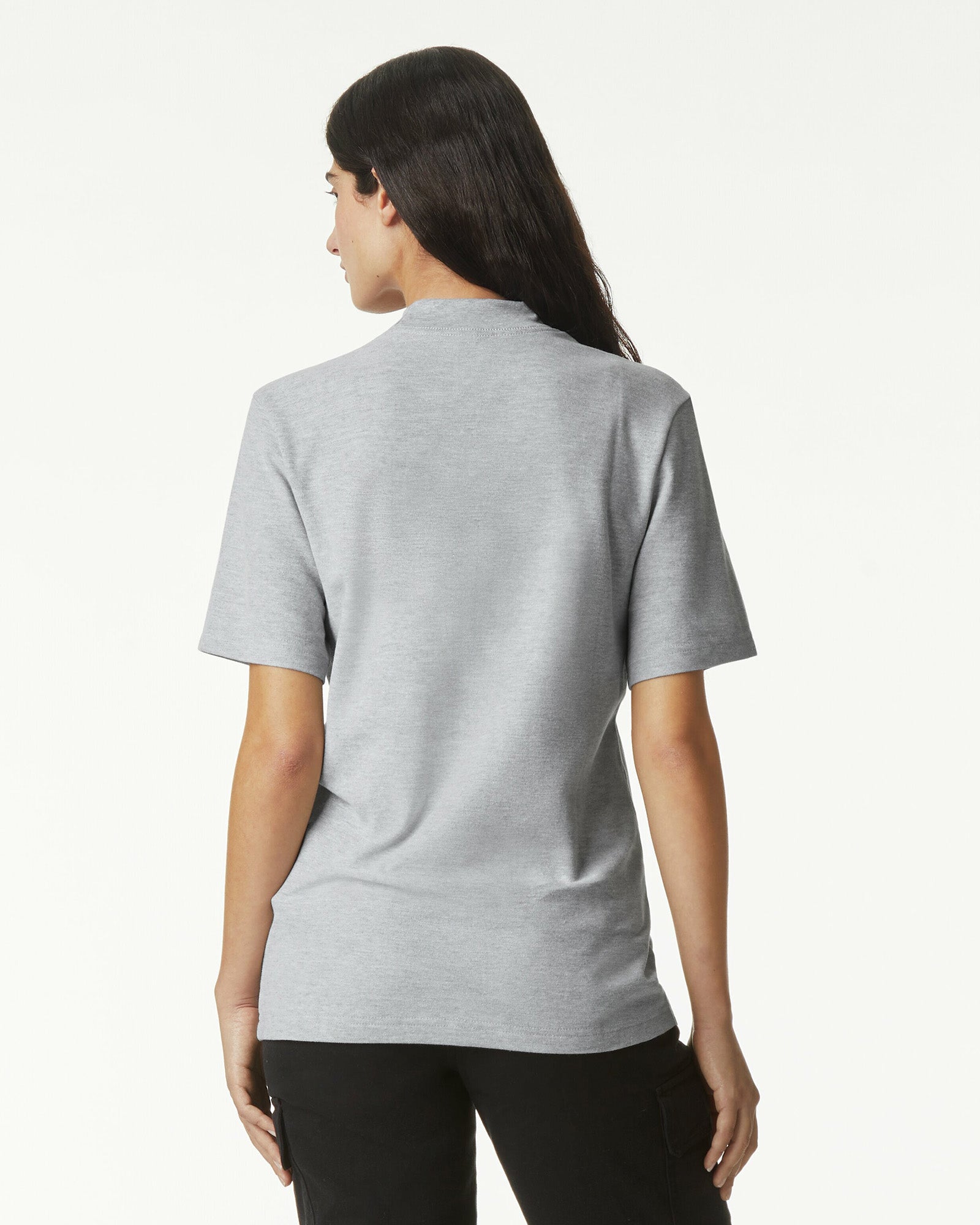 Female model wearing a Pique Unisex Mockneck Tee (back pose) -heather grey