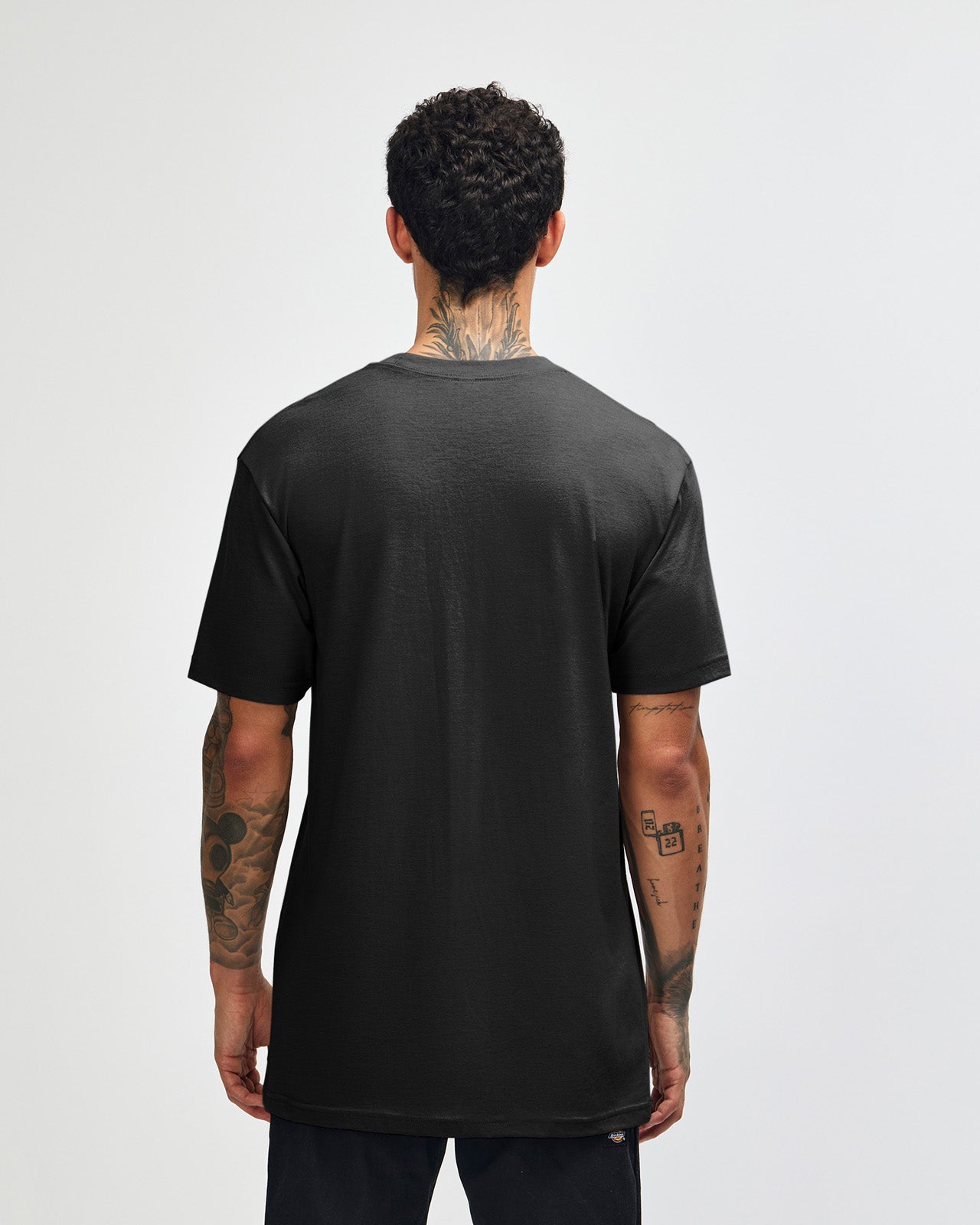 Male model wearing heather black colour CVC Unisex Short Sleeve Crew Neck Tee (black pose) -black