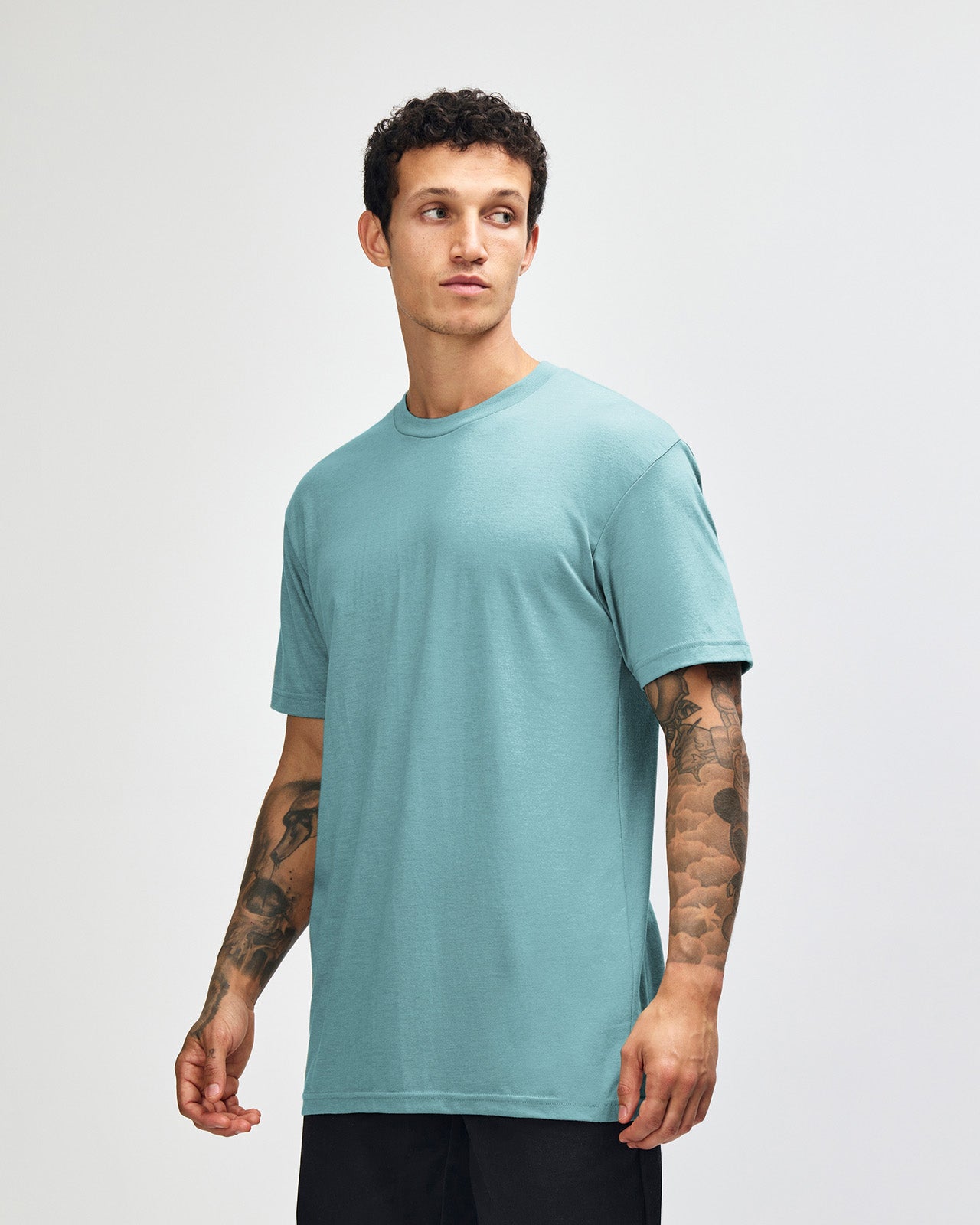 Male model wearing heather arctic colour CVC Unisex Short Sleeve Crew Neck Tee (front pose) -heather arctic