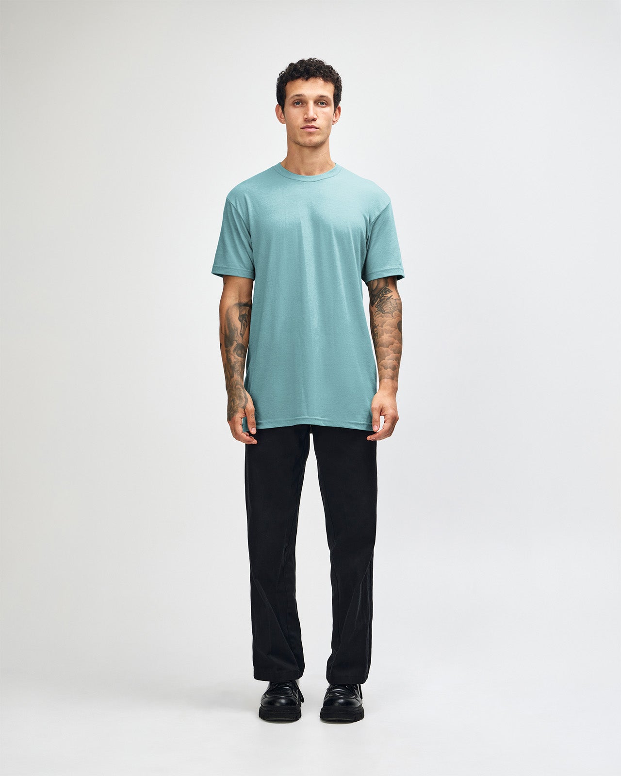 Male model wearing heather arctic colour CVC Unisex Short Sleeve Crew Neck Tee (front pose) -heather arctic