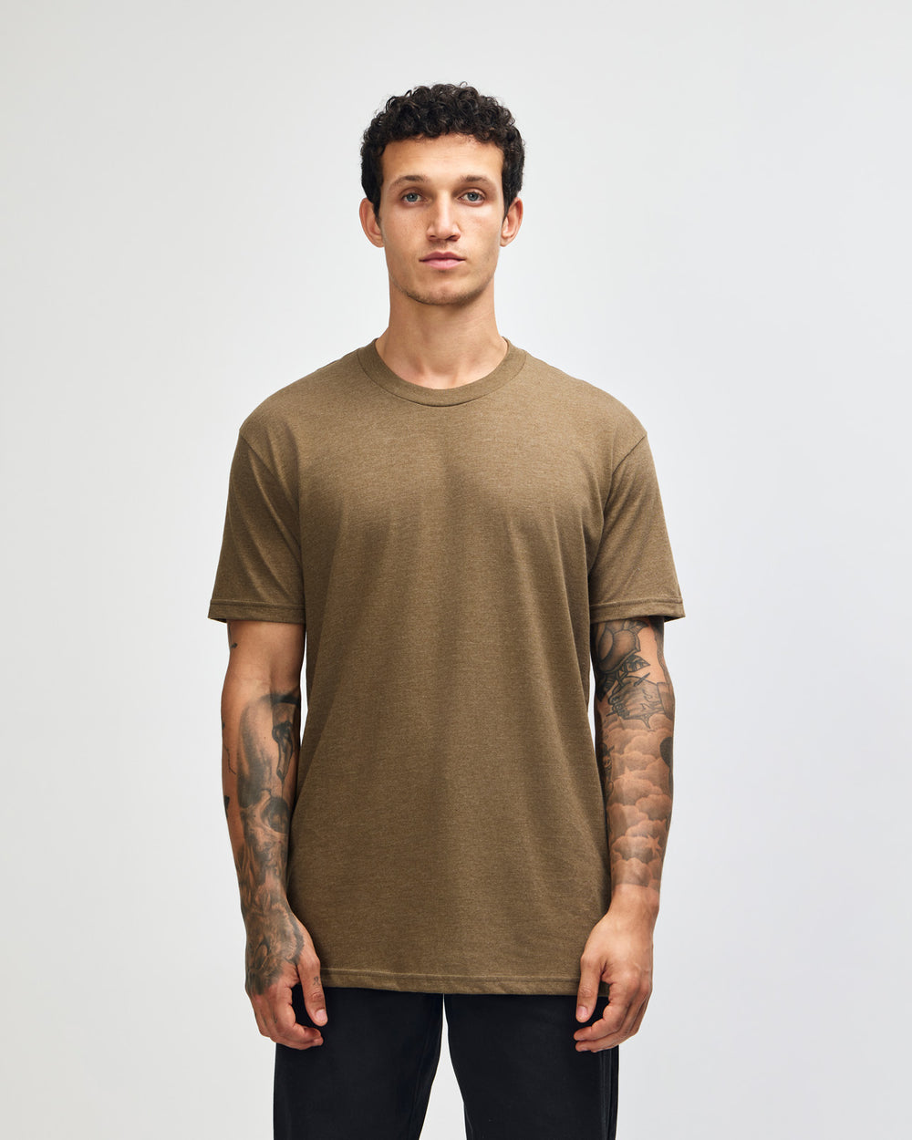 next image of Unisex Poly-Cotton : Male model wearing heather army colour CVC Unisex Short Sleeve Crew Neck Tee (front pose) -heather army