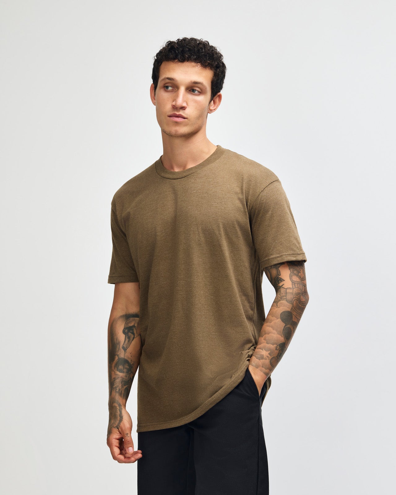 Male model wearing heather army colour CVC Unisex Short Sleeve Crew Neck Tee (front pose) -heather army