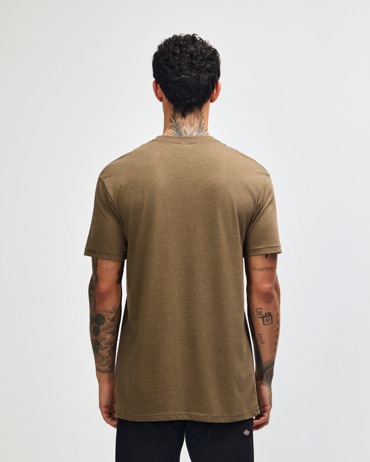 Male model wearing heather army colour CVC Unisex Short Sleeve Crew Neck Tee (back pose) -heather army