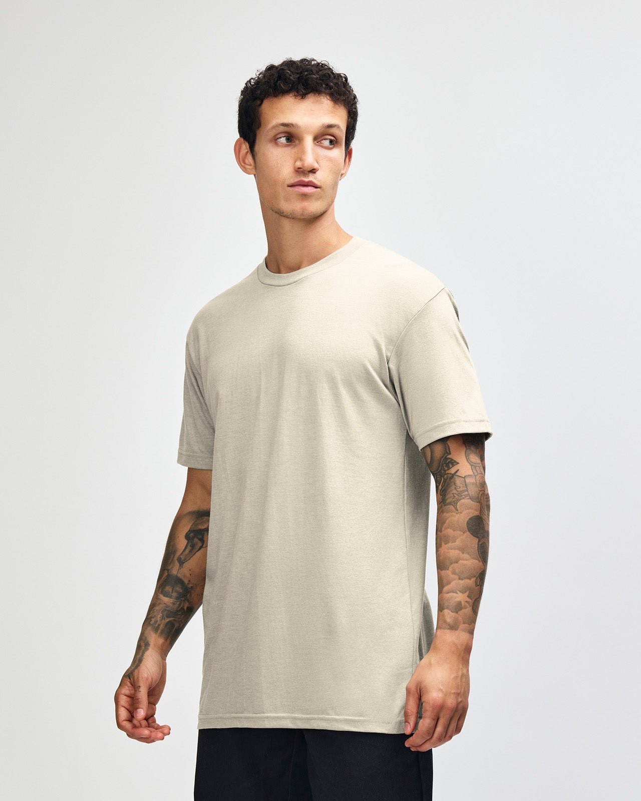 Male model wearing heather bone colour CVC Unisex Short Sleeve Crew Neck Tee (front pose) -heather bone