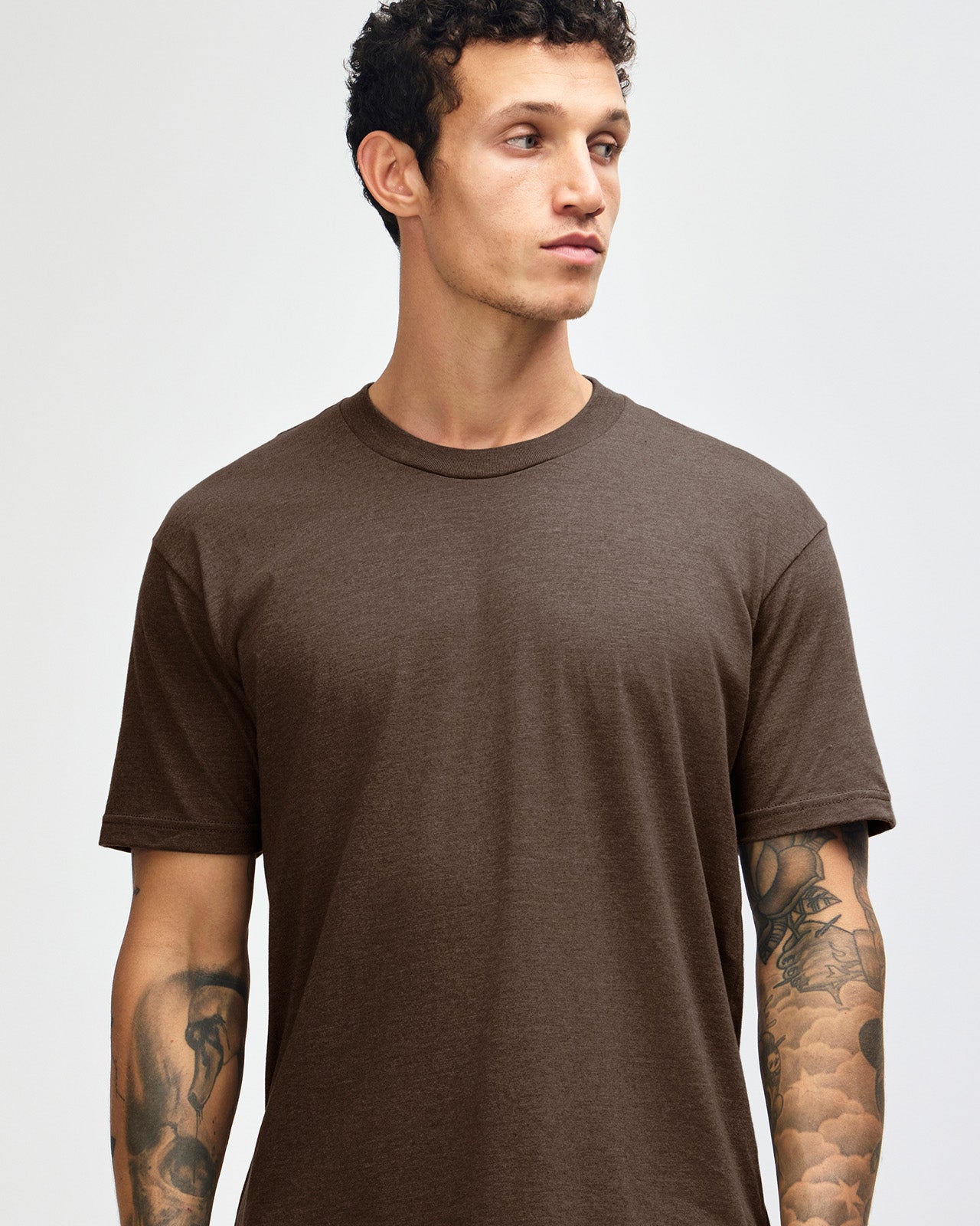 Male model wearing heather brown colour CVC Unisex Short Sleeve Crew Neck Tee (front pose) -heather brown