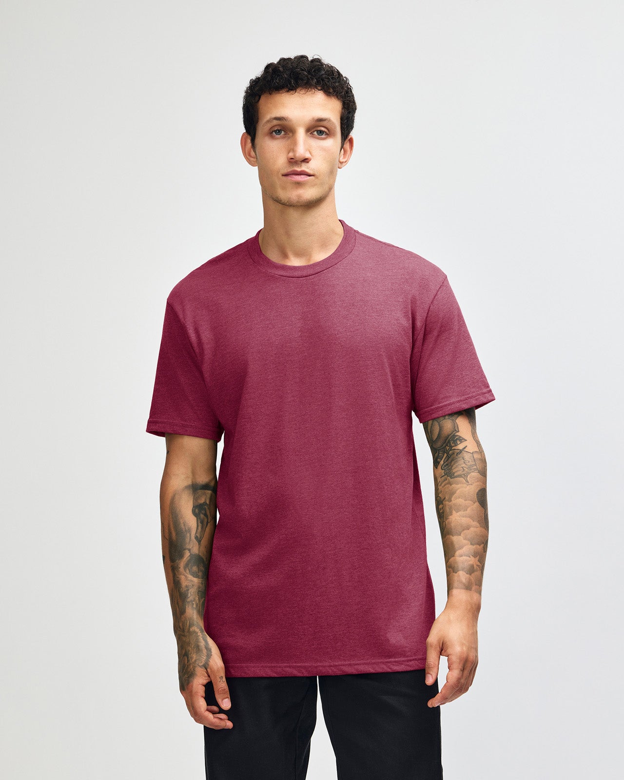 Male model wearing heather burgundy colour CVC Unisex Short Sleeve Crew Neck Tee (front pose) -heather burgundy