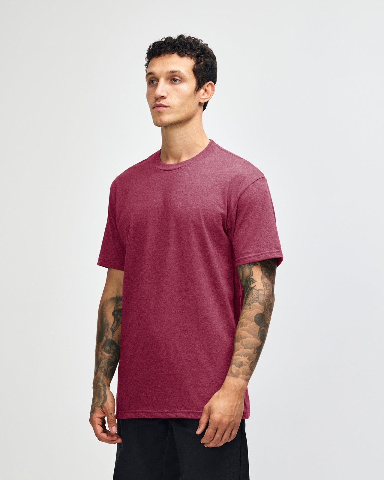 Male model wearing heather burgundy colour CVC Unisex Short Sleeve Crew Neck Tee (front pose) -heather burgundy