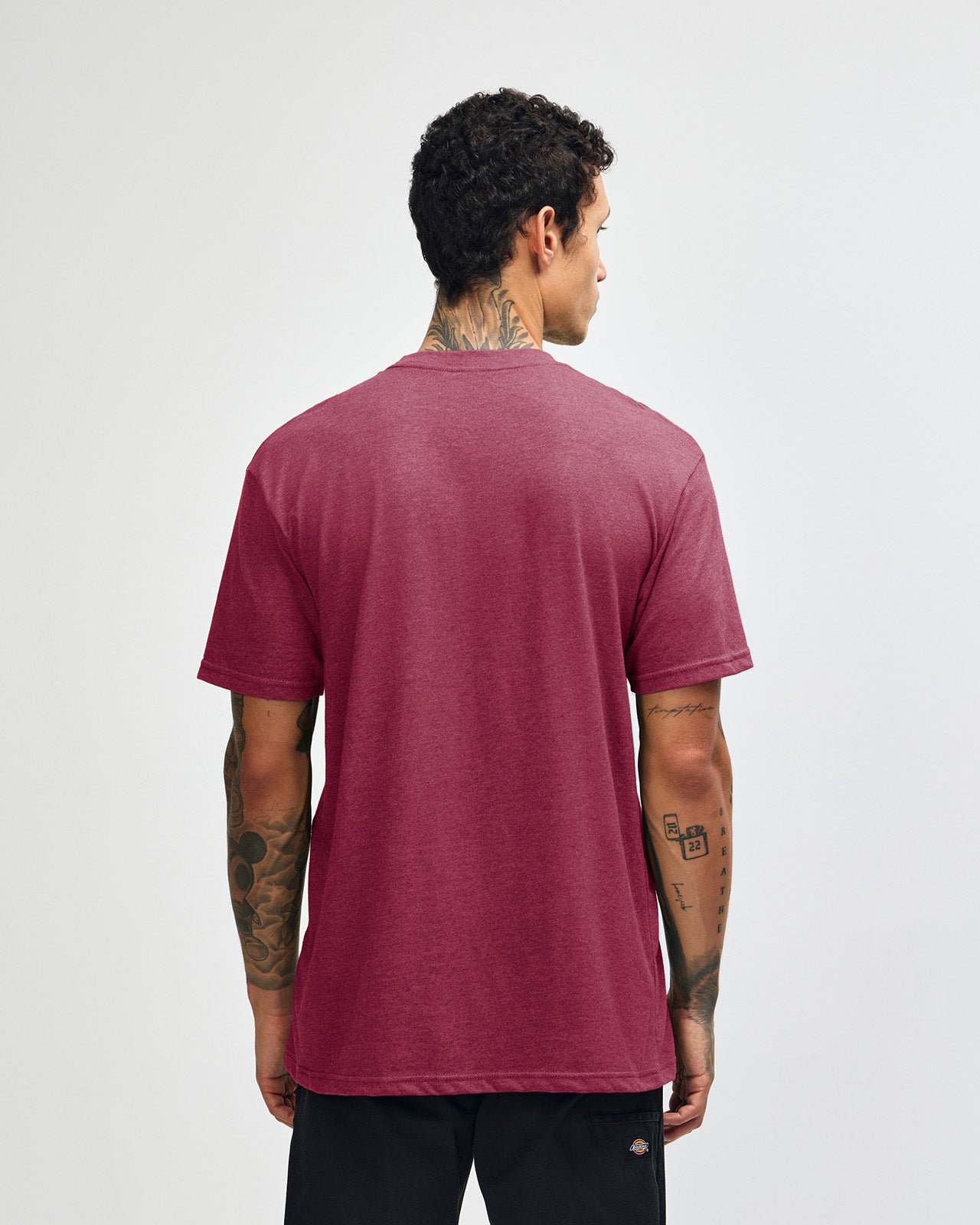 Male model wearing heather burgundy colour CVC Unisex Short Sleeve Crew Neck Tee (back pose) -heather burgundy