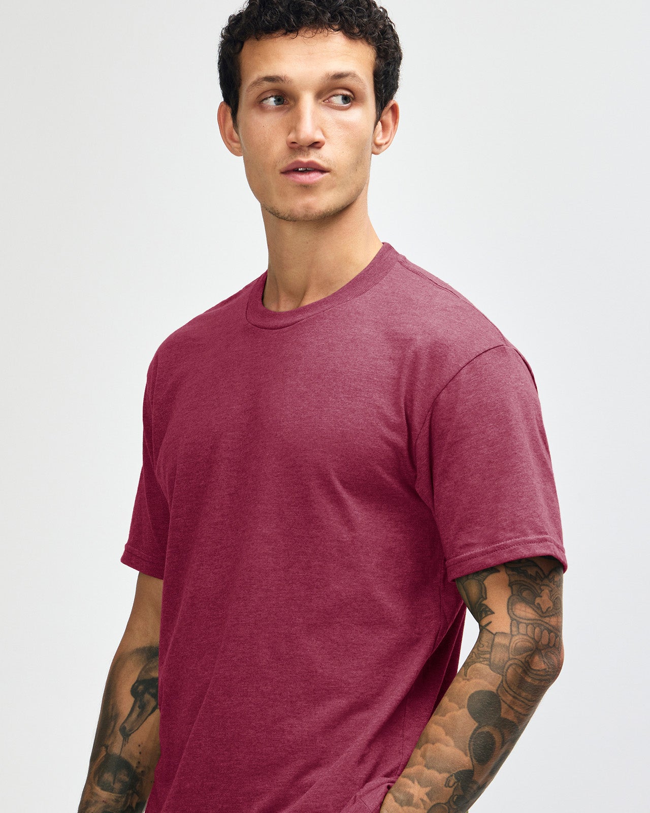 Male model wearing heather burgundy colour CVC Unisex Short Sleeve Crew Neck Tee (front pose) -heather burgundy