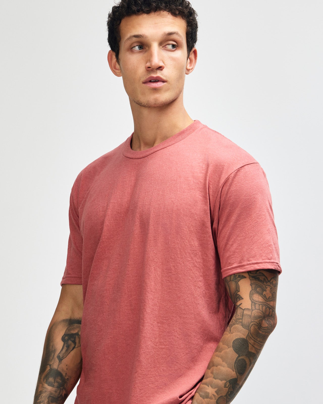 Male model wearing heather canyon colour CVC Unisex Short Sleeve Crew Neck Tee (front pose) -heather canyon