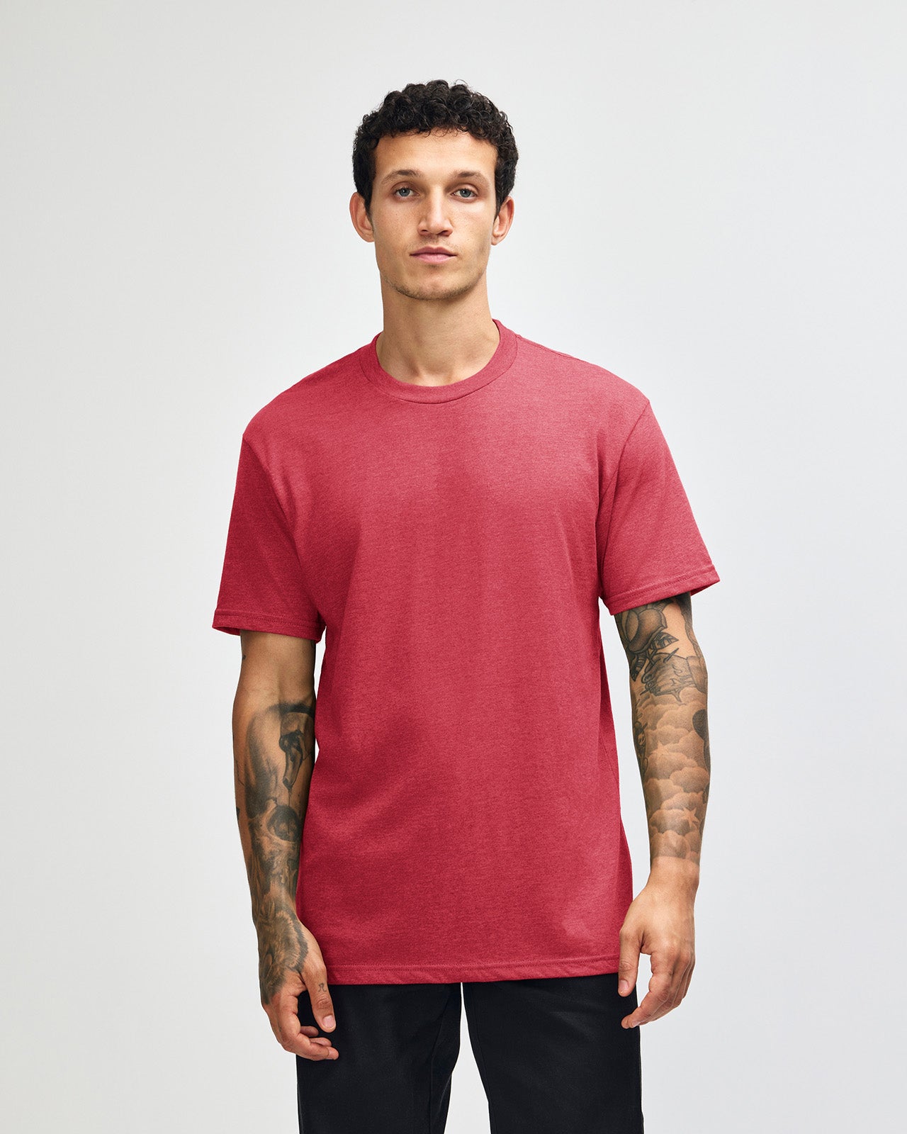 Male model wearing heather Cardinal colour CVC Unisex Short Sleeve Crew Neck Tee (front pose) -heather cardinal