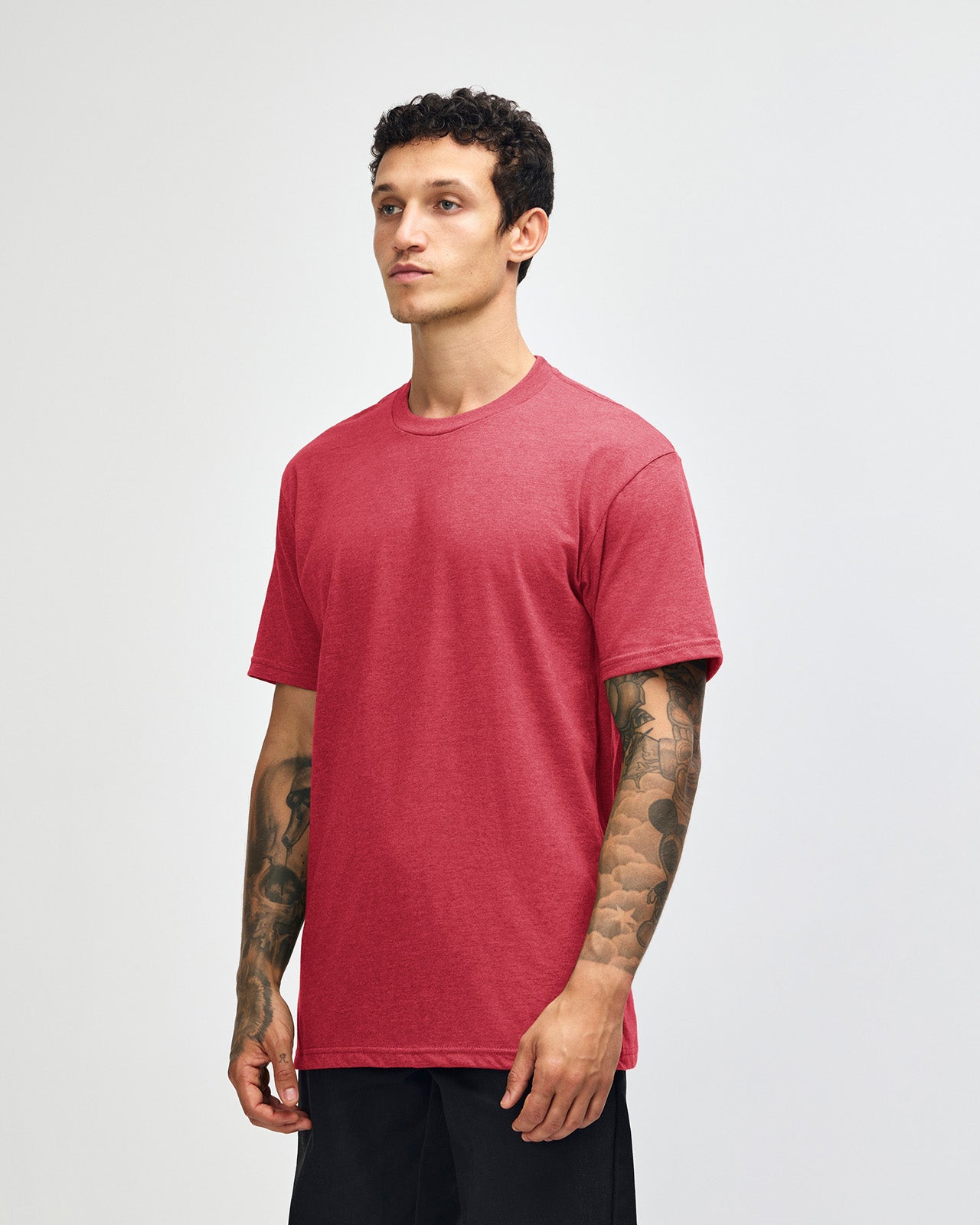 Male model wearing heather Cardinal colour CVC Unisex Short Sleeve Crew Neck Tee (front pose) -heather cardinal