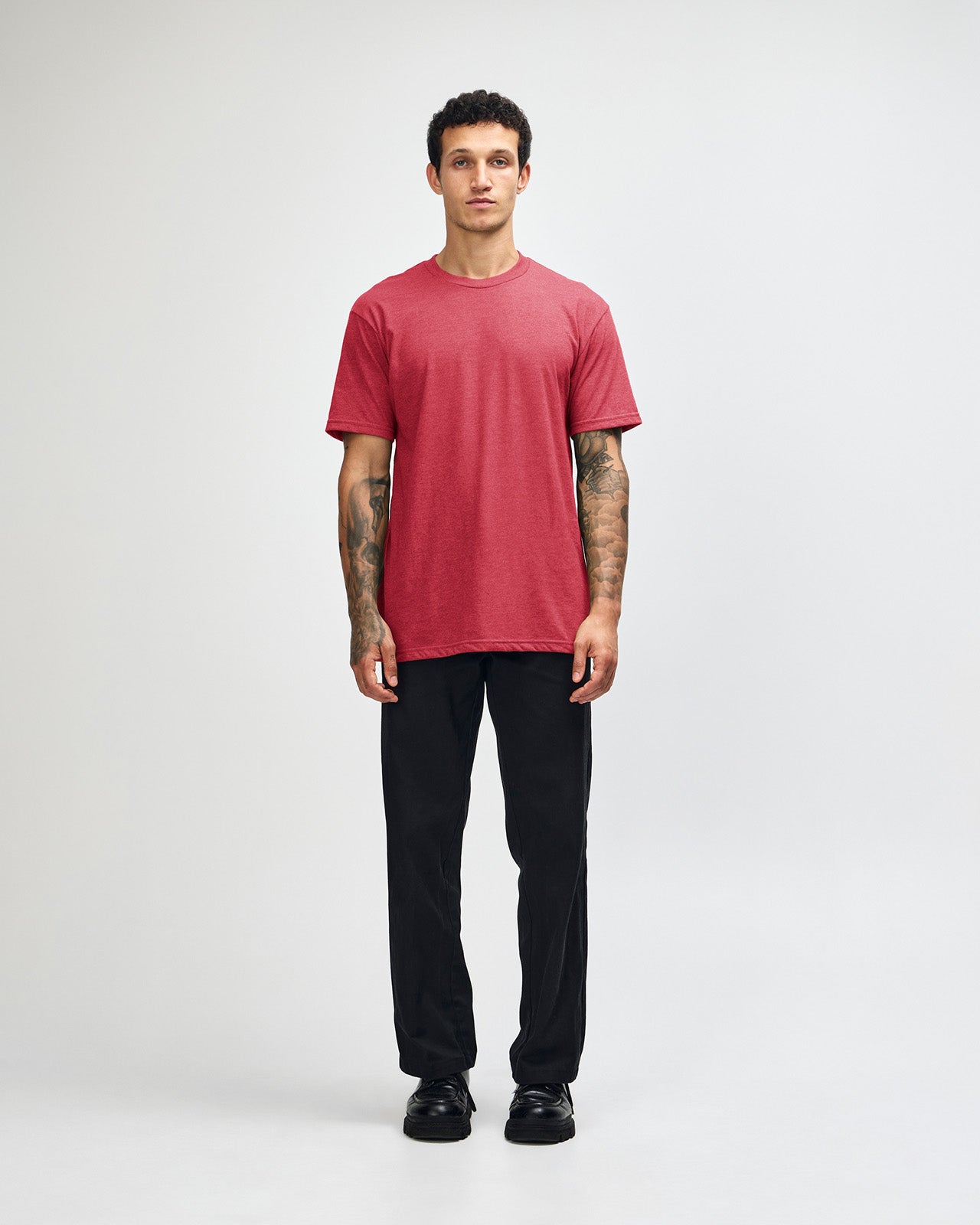 Male model wearing heather Cardinal colour CVC Unisex Short Sleeve Crew Neck Tee (front pose) -heather cardinal