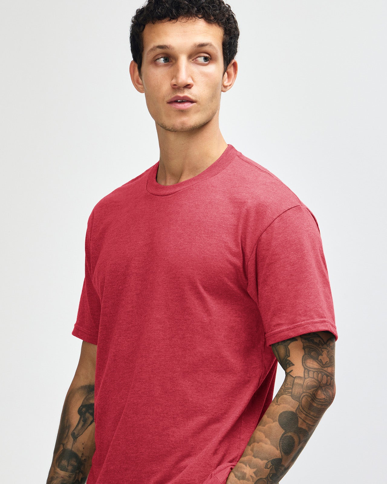 Male model wearing heather Cardinal colour CVC Unisex Short Sleeve Crew Neck Tee (front pose) -heather cardinal