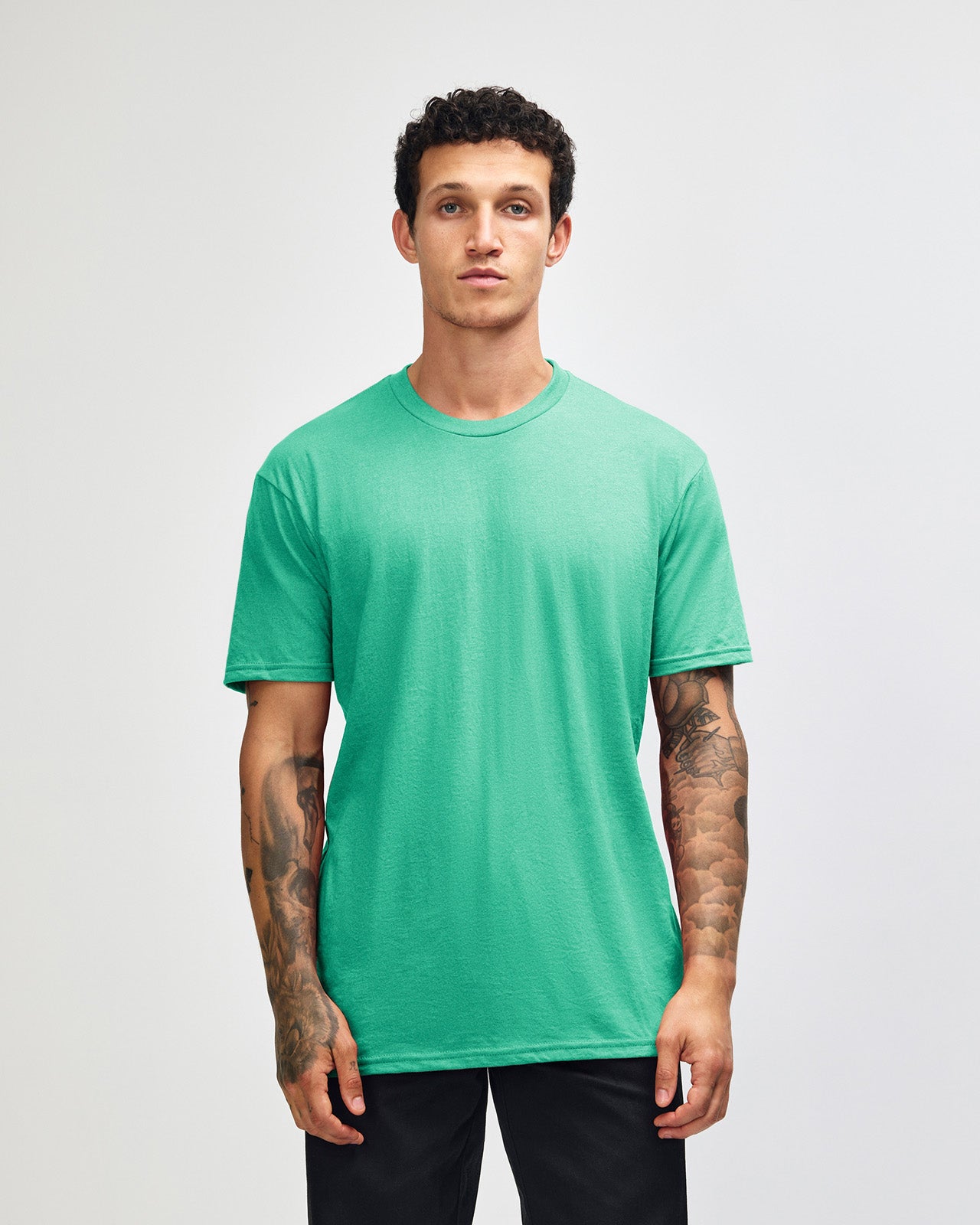 Male model wearing heather celadon colour CVC Unisex Short Sleeve Crew Neck Tee (front pose) -heather celadon