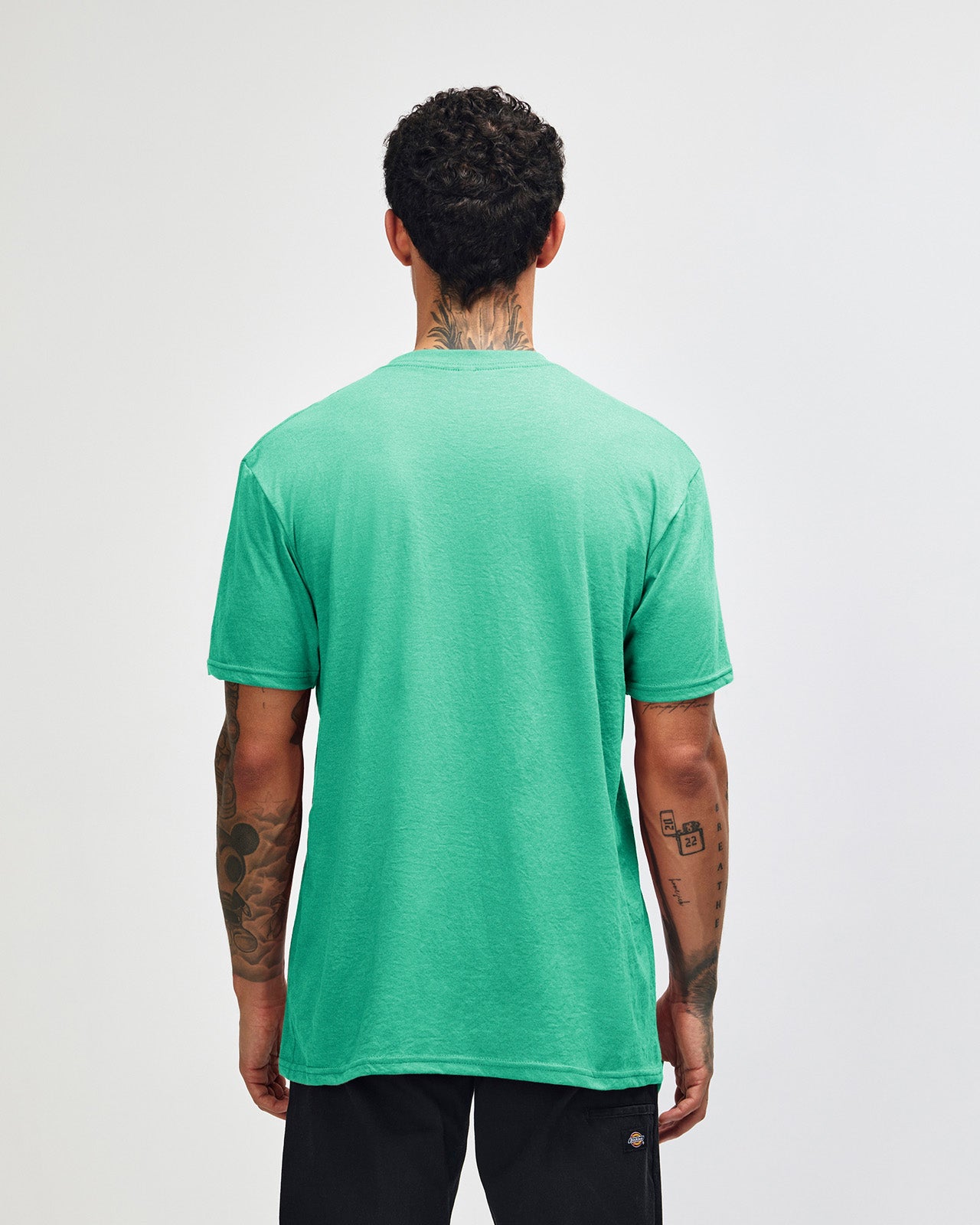 Male model wearing heather celadon colour CVC Unisex Short Sleeve Crew Neck Tee (back pose) -heather celadon