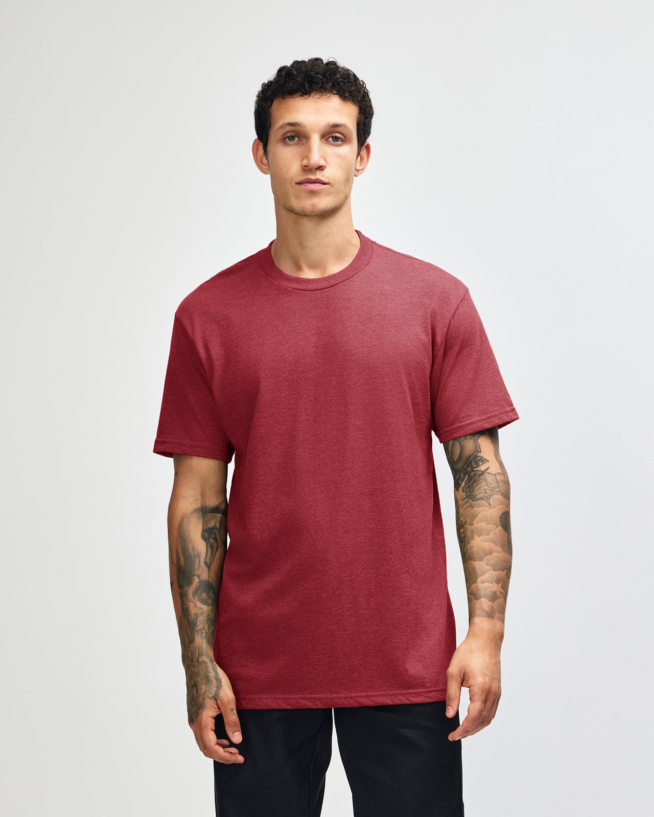 Male model wearing heather cranberry colour CVC Unisex Short Sleeve Crew Neck Tee (front pose) -heather cranberry