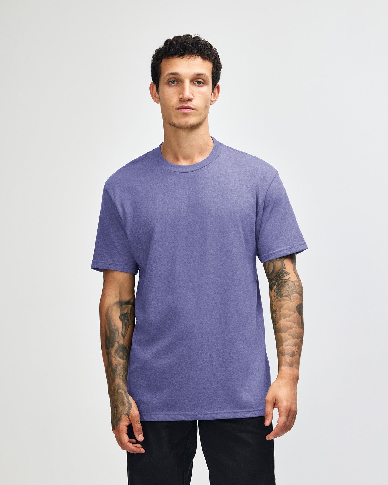 Male model wearing heather grape colour CVC Unisex Short Sleeve Crew Neck Tee (front pose) -heather grape
