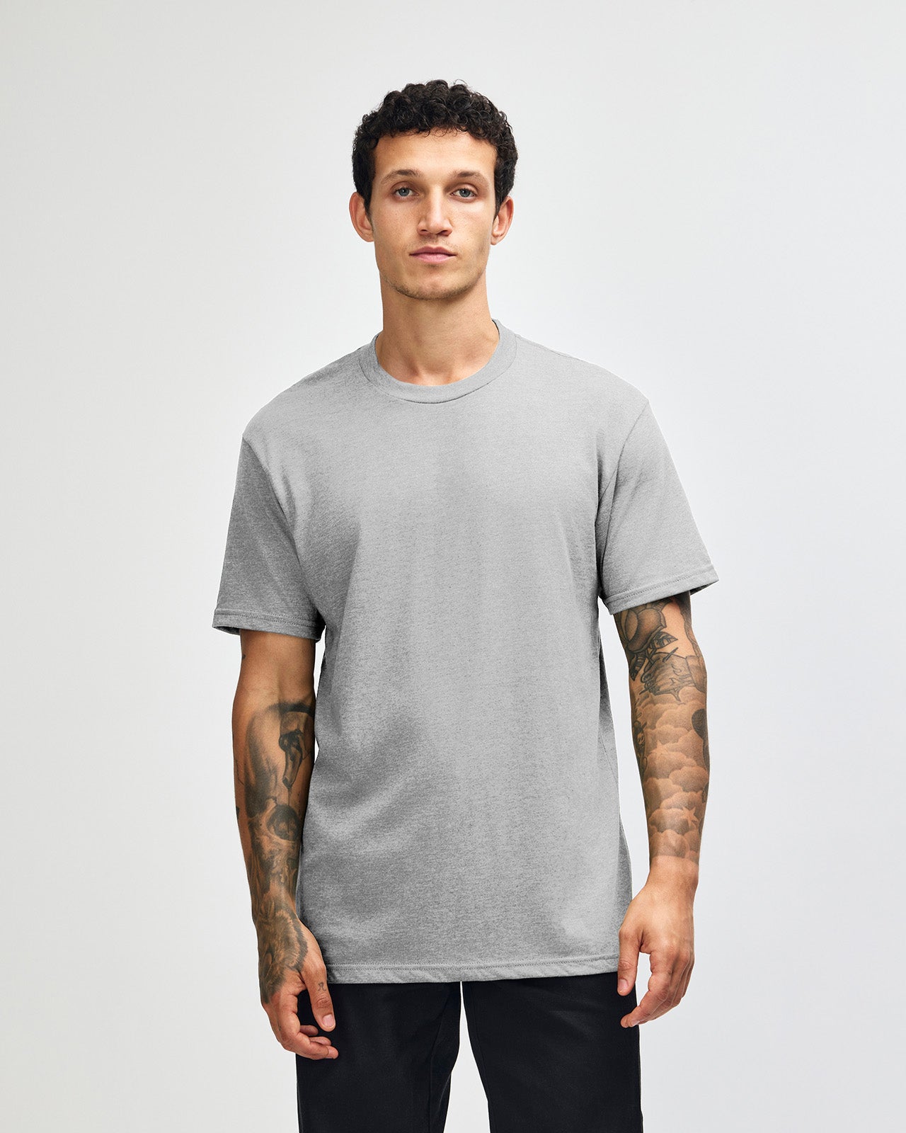 Male model wearing heather grey colour CVC Unisex Short Sleeve Crew Neck Tee (front pose) -heather grey